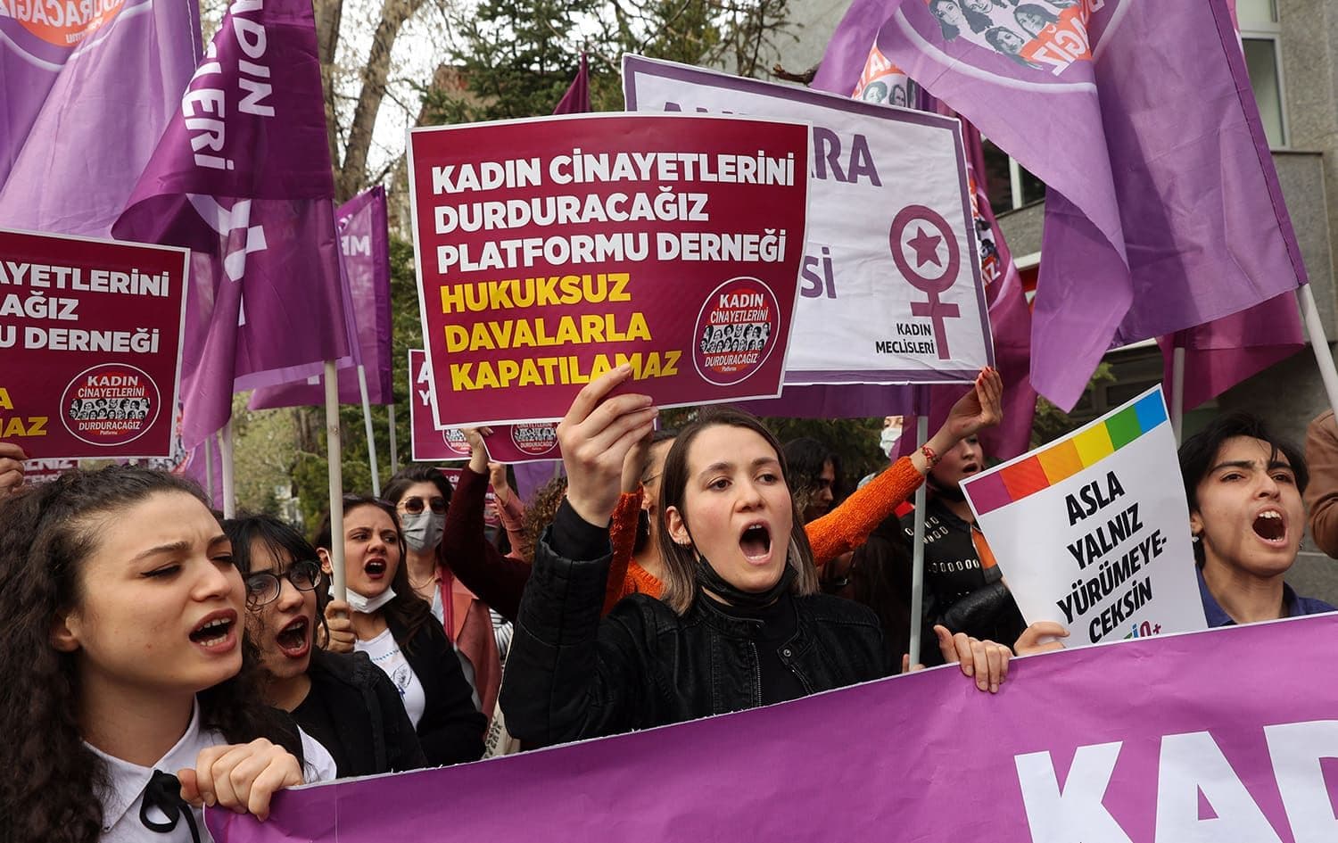 Women hold up banners and shout slogans as they protest against the closure case filed against the 'We Will Stop Femicide Platform Association' in Ankara on April 16, 2022. Photo: Adem Altan/AFP