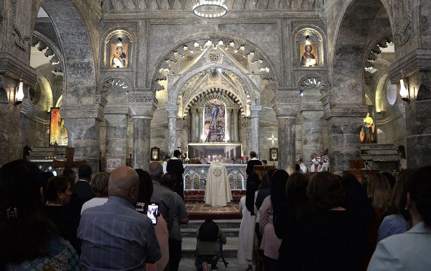 Christian worshippers attend mass at the Syriac Catholic Church of Mar Tuma (Saint Thomas) in Mosul, on April 30, 2022. Photo: Zaid al-Obeidi/AFP