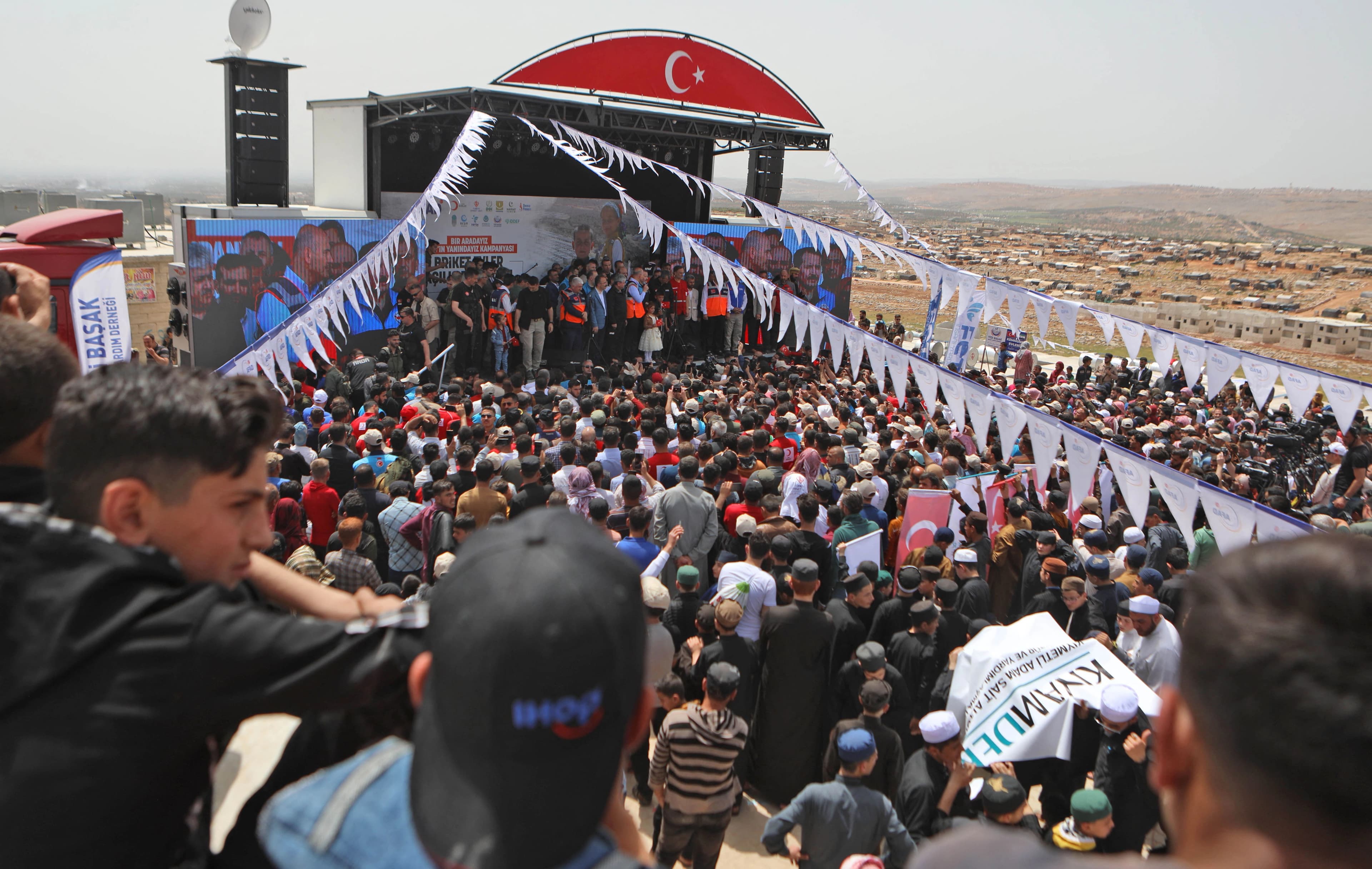 Turkish Minister of Interior Süleyman Soylu inaugurates a housing complex for internally displaced Syrians built with Turkey's support, at the Kammouneh camps near the town of Sarmada in Syria's northwestern Idlib province, on May 3, 2022. Photo: Aaref Watad/AFP