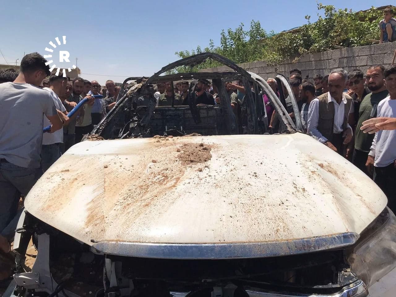 The vehicle that was targeted by unidentified air forces in Makhmour camp on May 21, 2022. Photo: Roj News
