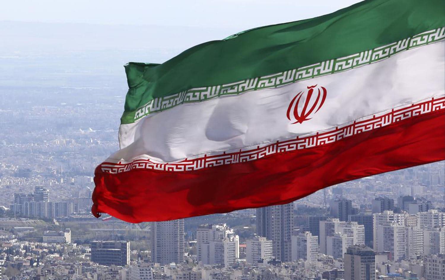 Iran’s national flag waves in its capital of Tehran on March 31, 2020. Photo: Vahid Salemi/AP