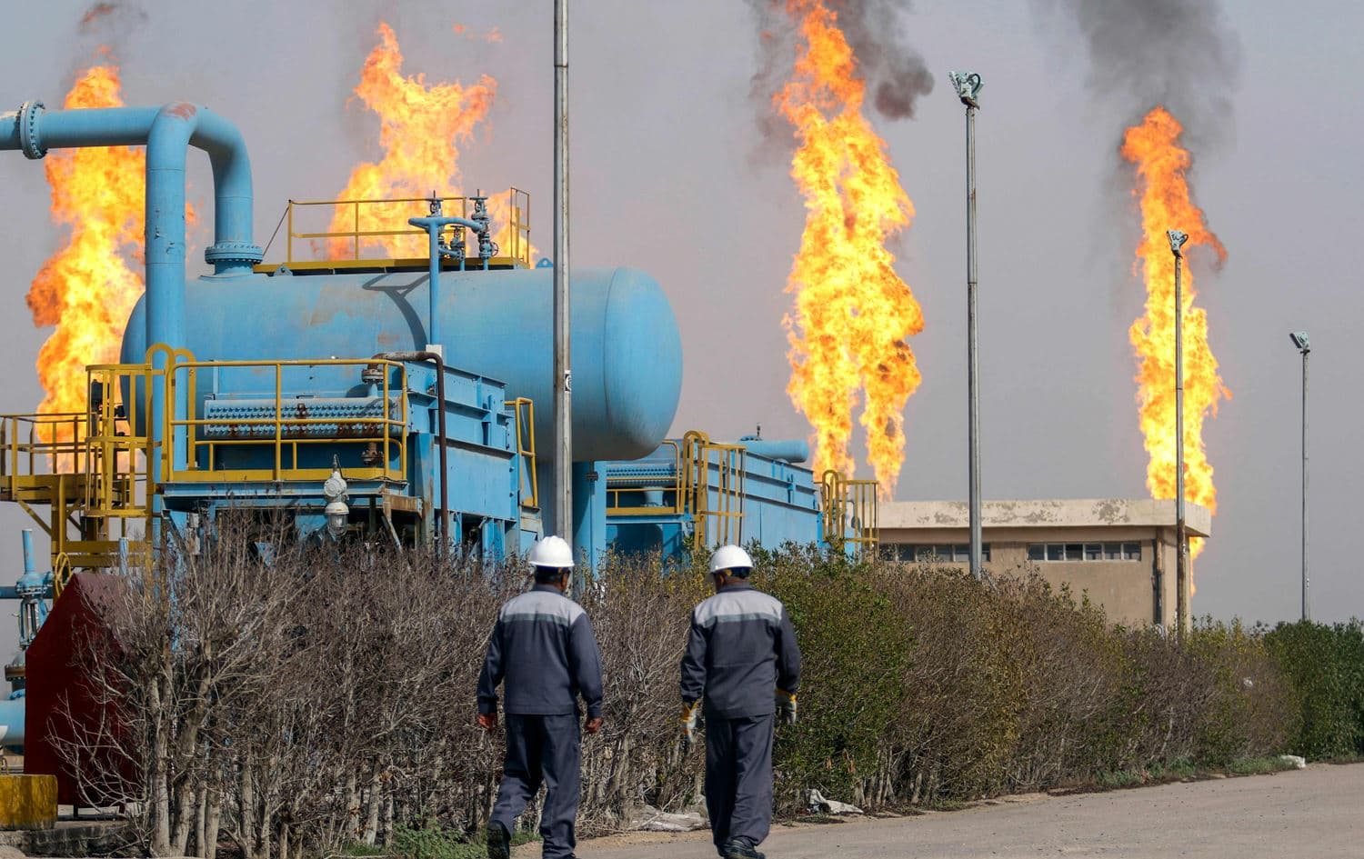 Workers at the Nahr Bin Omar field in Basra, Iraq. Photo: AFP