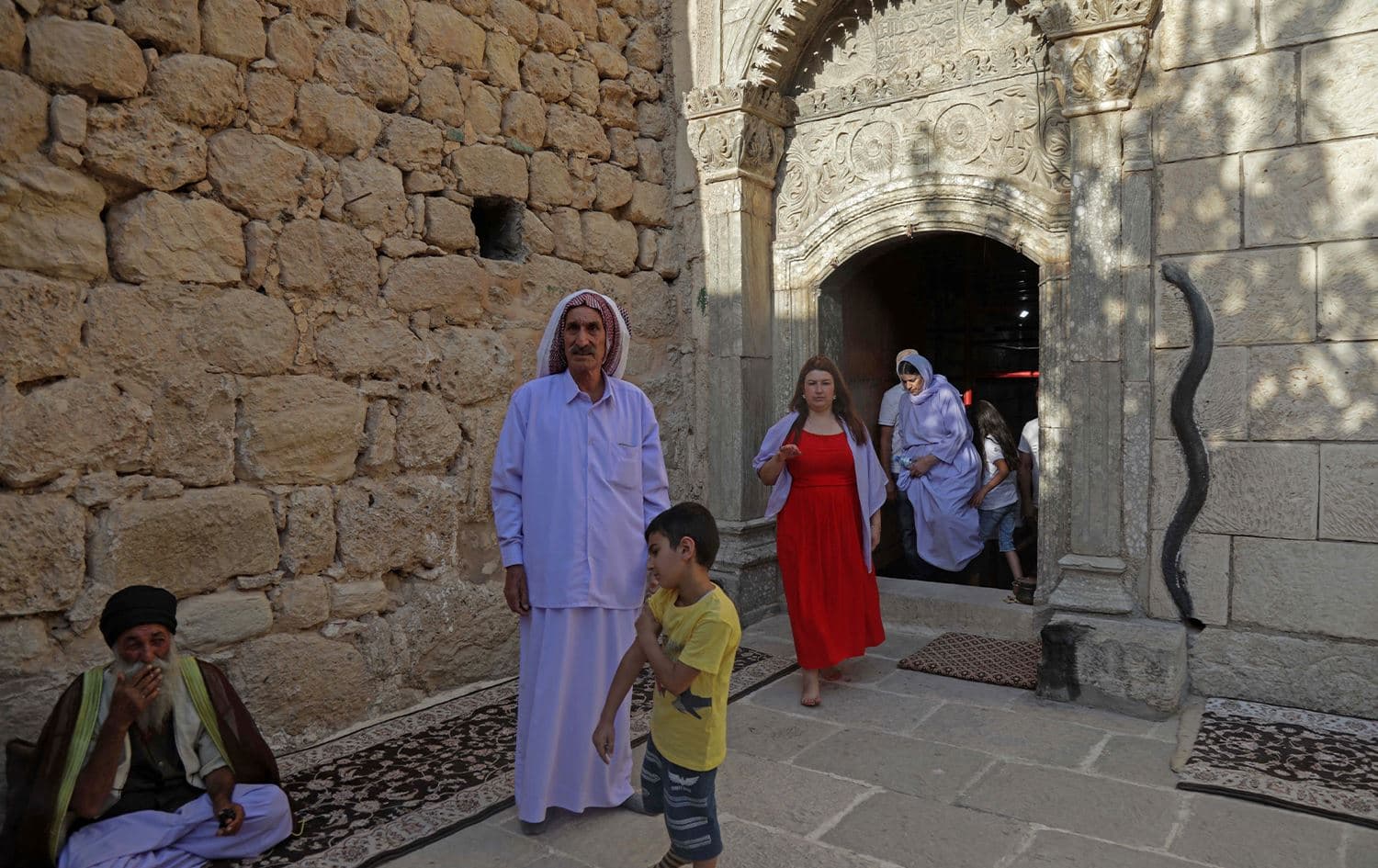 Yazidis gather during a religious ceremony at the holy temple of Lalish near Duhok, Kurdistan Region on August 1, 2022. Photo: Safin Hamed/AFP