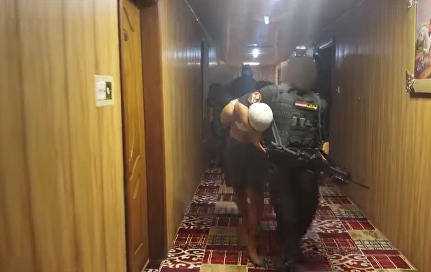 Iraqi security forces arresting the suspect accused of armoring vehicles and making improvised explosives for ISIS. Photo: screenshot/Iraqi National Security Service/Facebook
