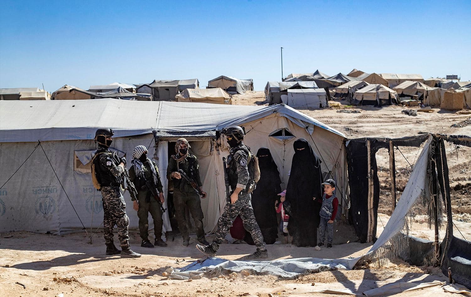 Kurdish security forces inspect tents at the Kurdish-run al-Hol camp amid an ongoing operation against ISIS sleeper cells on August 28, 2022. Photo: Delil Souleiman/AFP