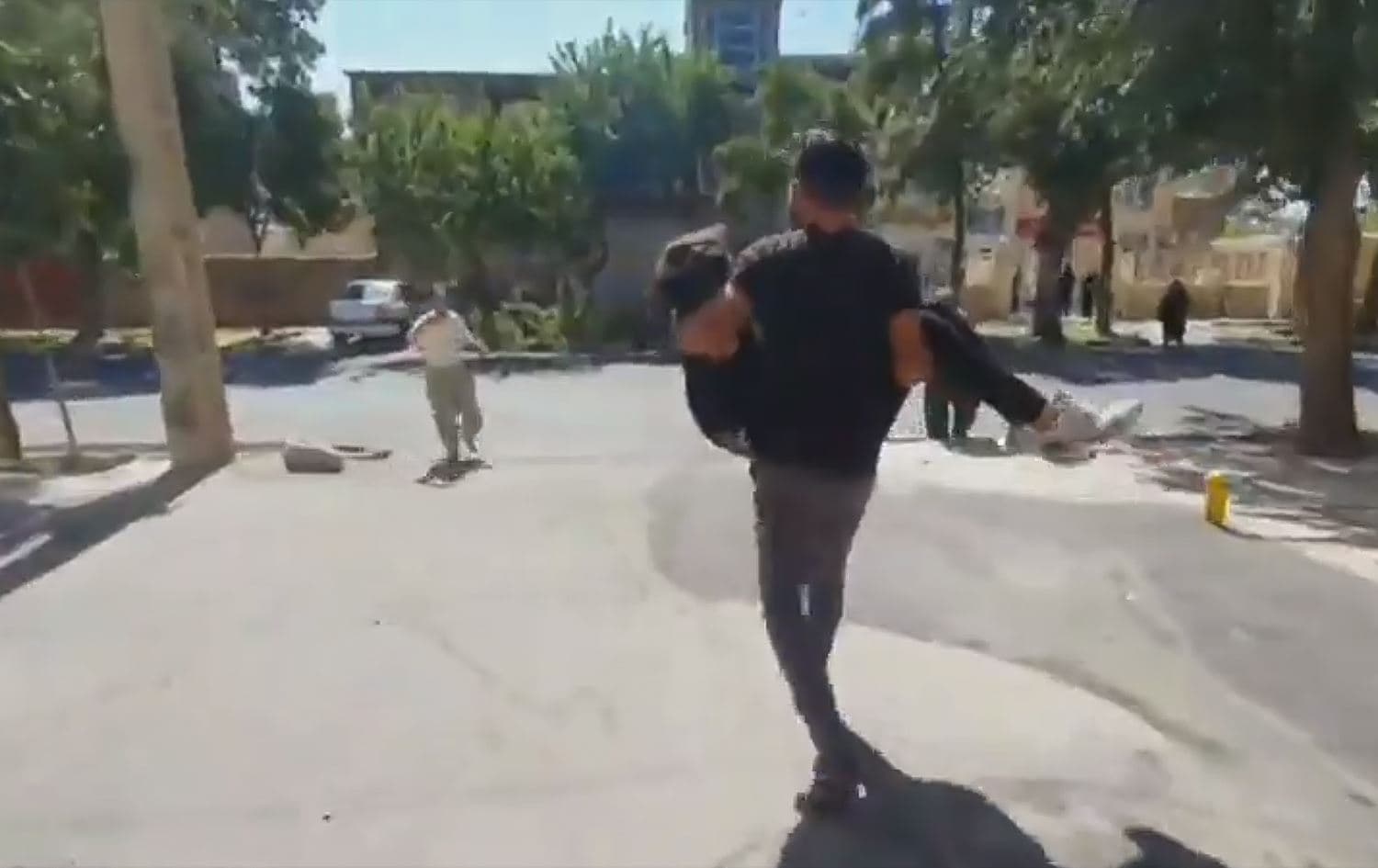 Screenshot from footage showing injured protesters being carried away after Iranian security forces opened fire at protesters in Saqqez, western Iran, on September 18, 2022. Photo: Kurdish social media inside Iran