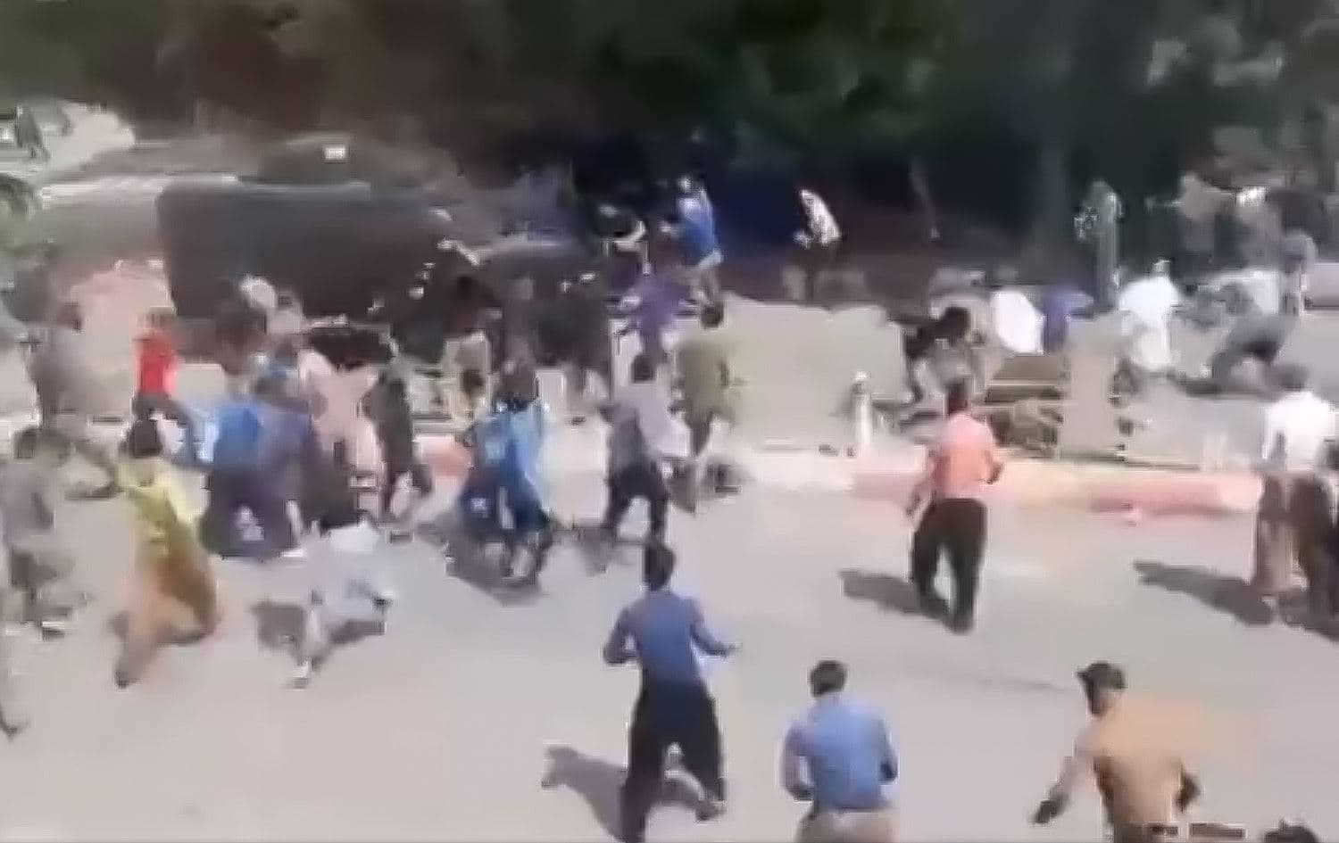 Screenshot from footage on social media depicting protesters under fire in the town of Divandarreh in Iran's Kurdistan province on September 19, 2022. Photo: Kurdistan Human Rights Network/Twitter