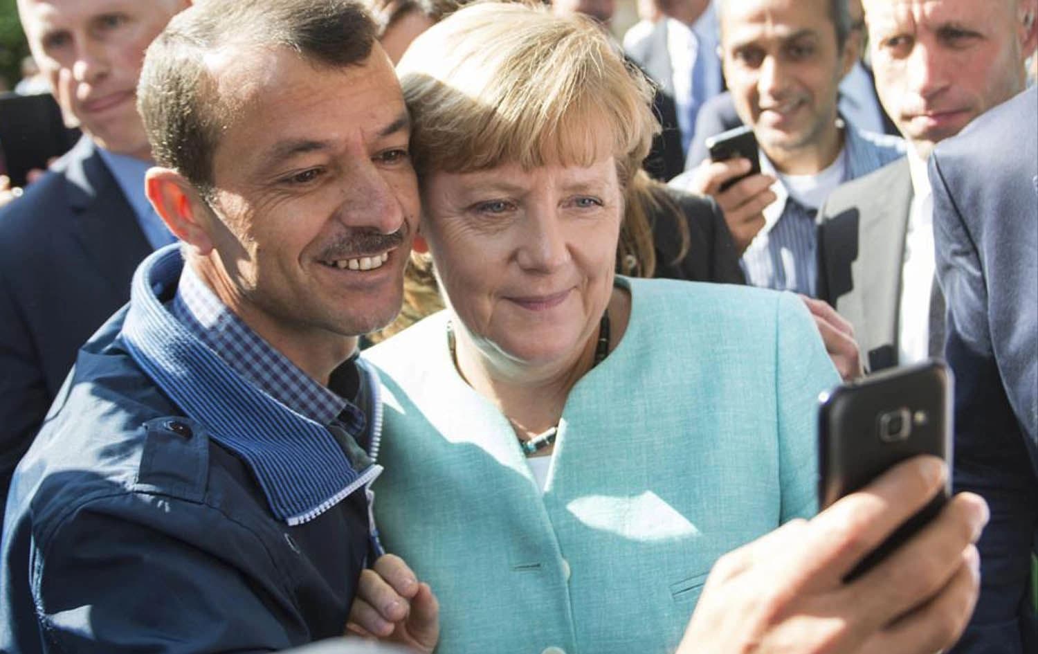 In this September 9, 2015 file photo German chancellor Angela Merkel poses for a selfie with a refugee in a facility in Berlin. File photo: AP