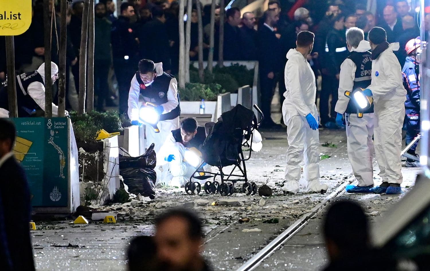 Members of a forensic team work after a strong explosion of unknown origin shook the busy shopping street of Istiklal in Istanbul, on November 13, 2022. Photo: Yasin Akgul/AFP