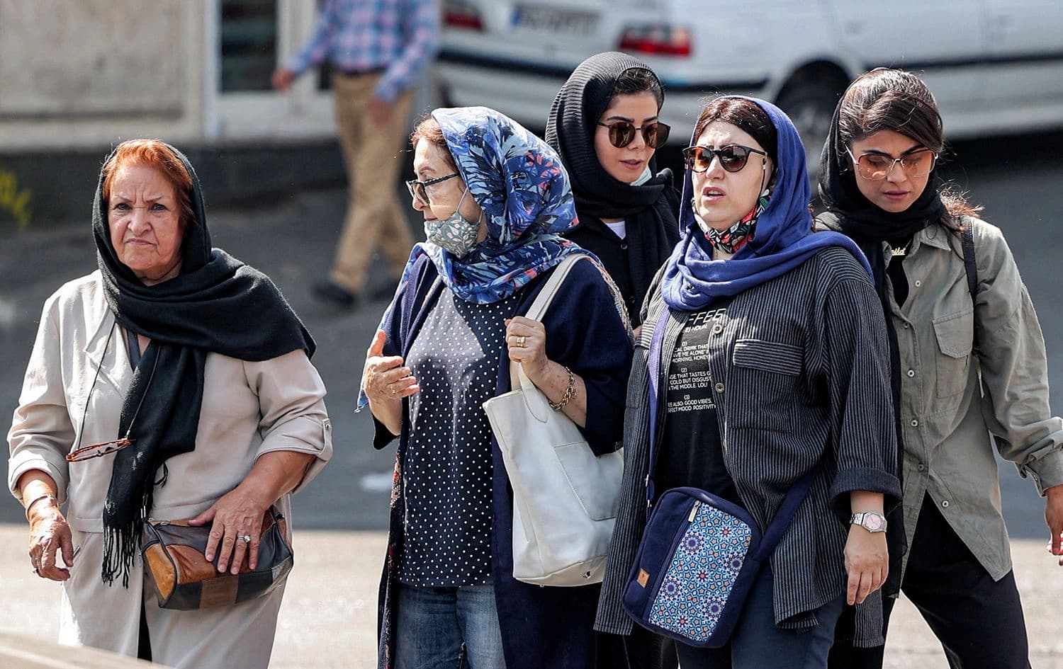 In this file photo taken on September 26, 2022, women walk along a street in the centre of Iran's capital Tehran. Photo: Atta Kenare/AFP