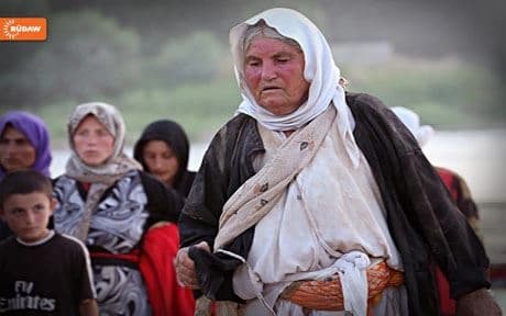 Exhausted Yezidis who escaped via Syrian Kurdistan in August. Photo by Seivan Mohammad