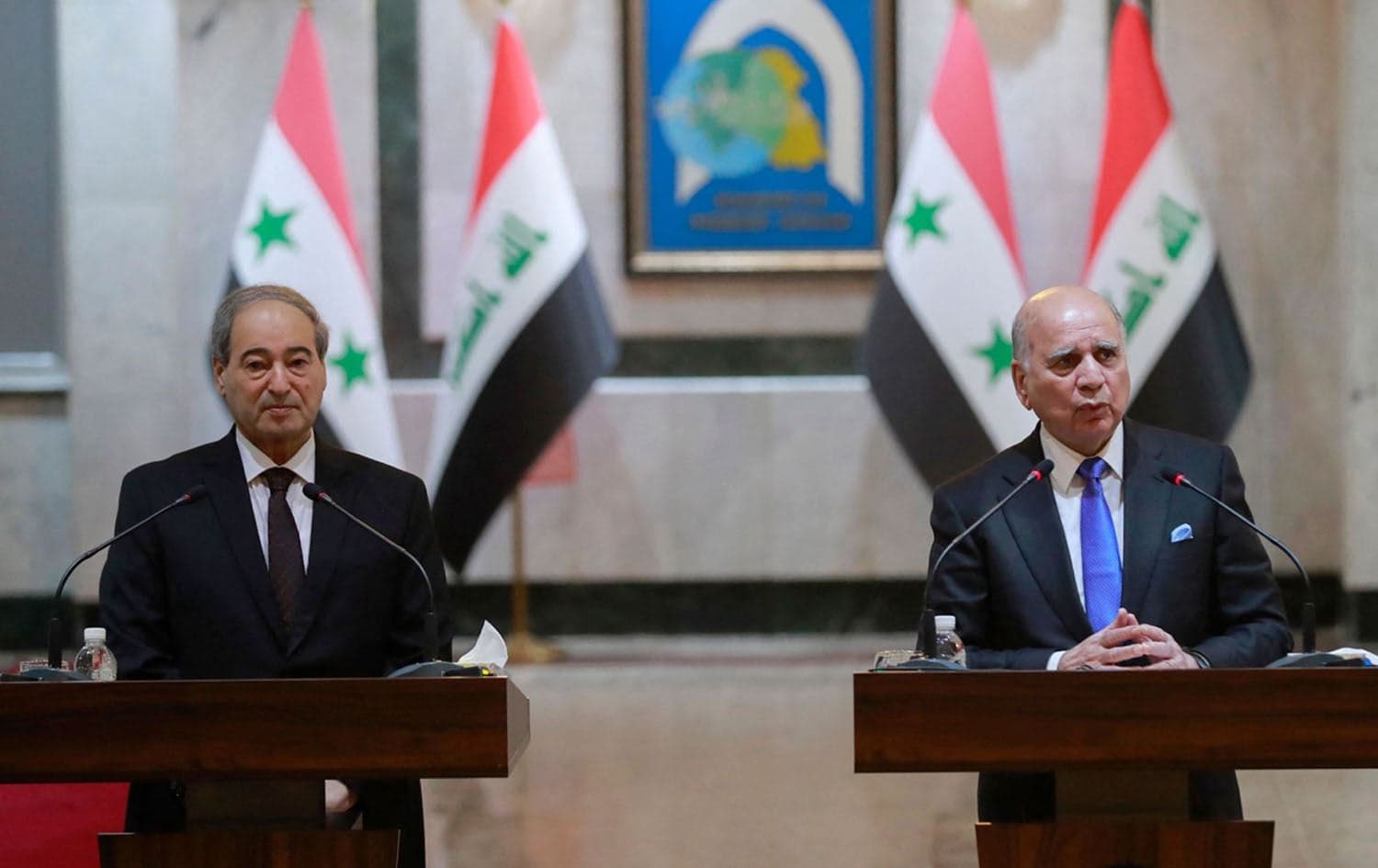 Iraqi Foreign Minister Fuad Hussein (R) and his Syrian counterpart Faisal Mekdad hold a press conference in Baghdad on June 4, 2023. Photo: Ahmed al-Rubaye/AFP