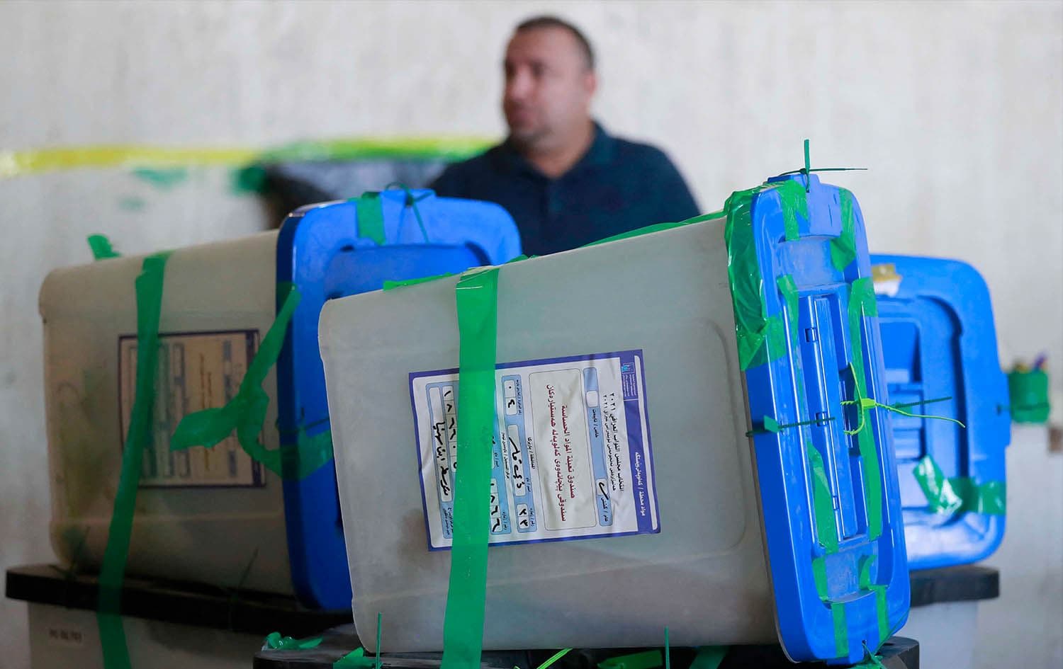 An employee stands by ballot boxes as Iraq's Independent High Electoral Commission conducts a partial manual recount of votes for the October 10 parliamentary elections, in the capital Baghdad on November 23, 2021. Photo: Ahmad Al-Rubaye/AFP
