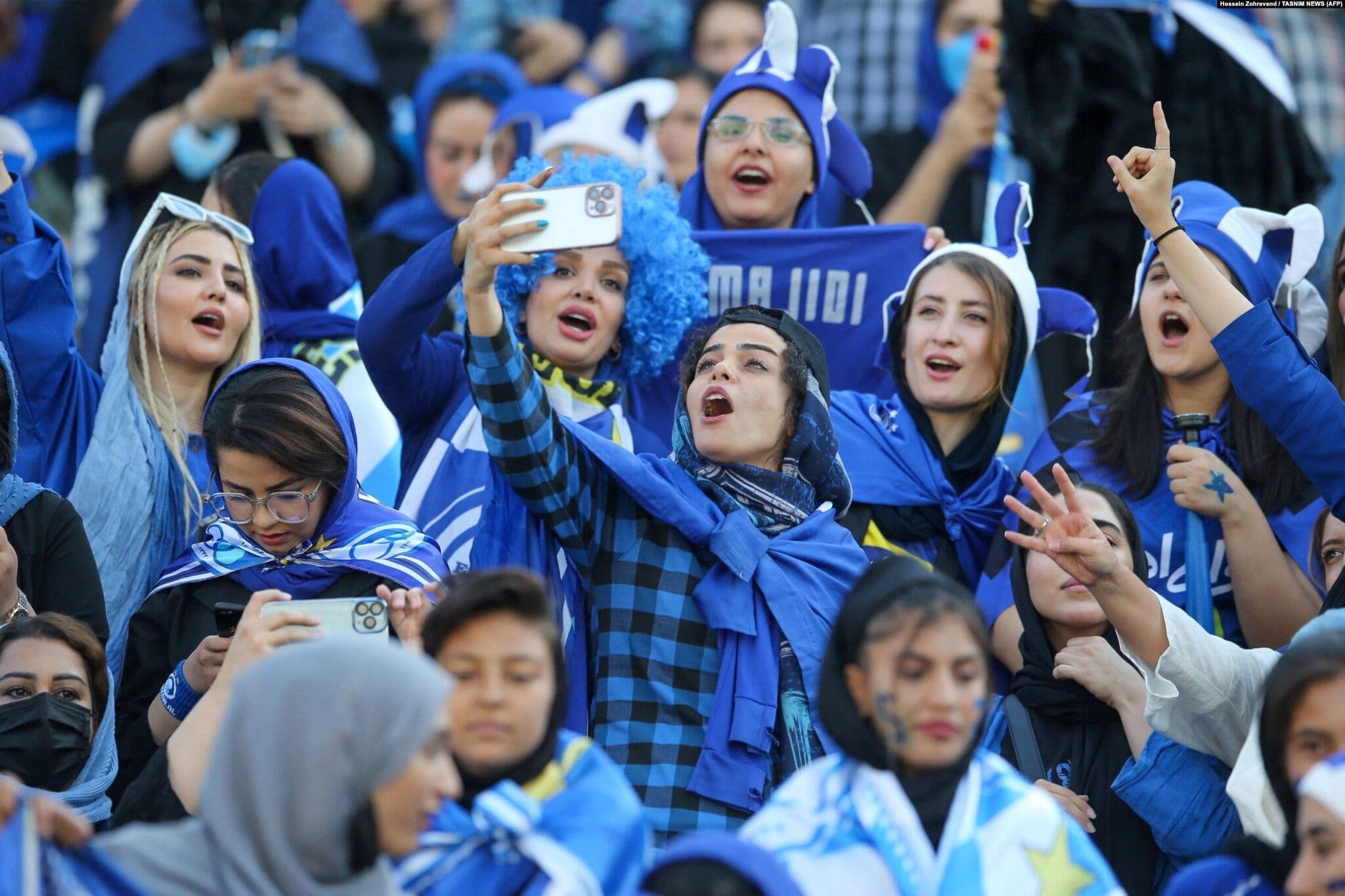 Female fans of the Esteghlal football club cheer during a match between Esteghlal and Mes-e Kerman at Azadi Stadium in Tehran on August 25, 2022. Photo: AFP