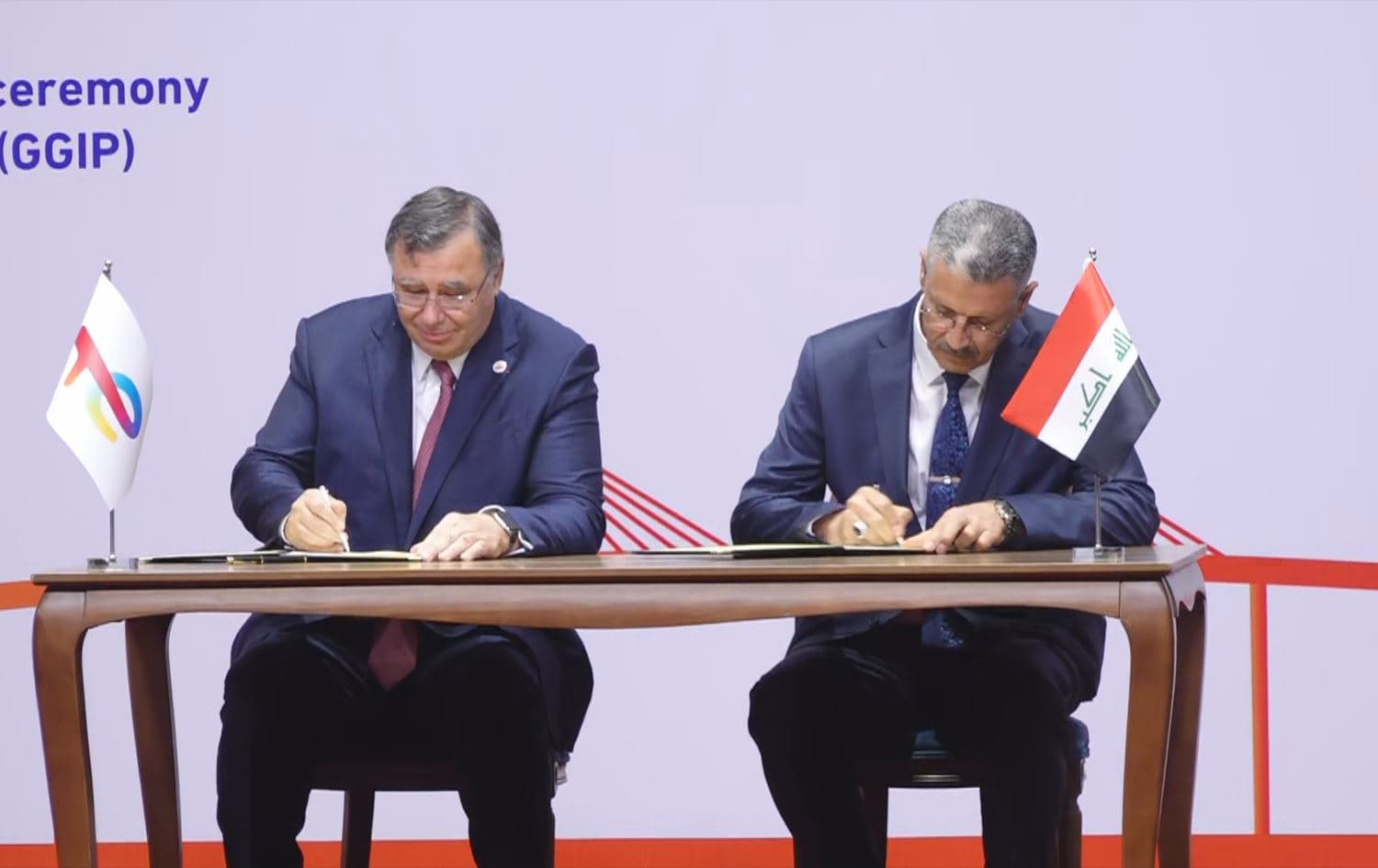 TotalEnergies CEO Patrick Pouyanne (left) and Iraqi Oil Minister Hayyan Abdul Ghani (right) signing the contract for the Gas Growth Integrated Project (GGIP) in a ceremony in Baghdad on July 10, 2023. Photo: Rudaw