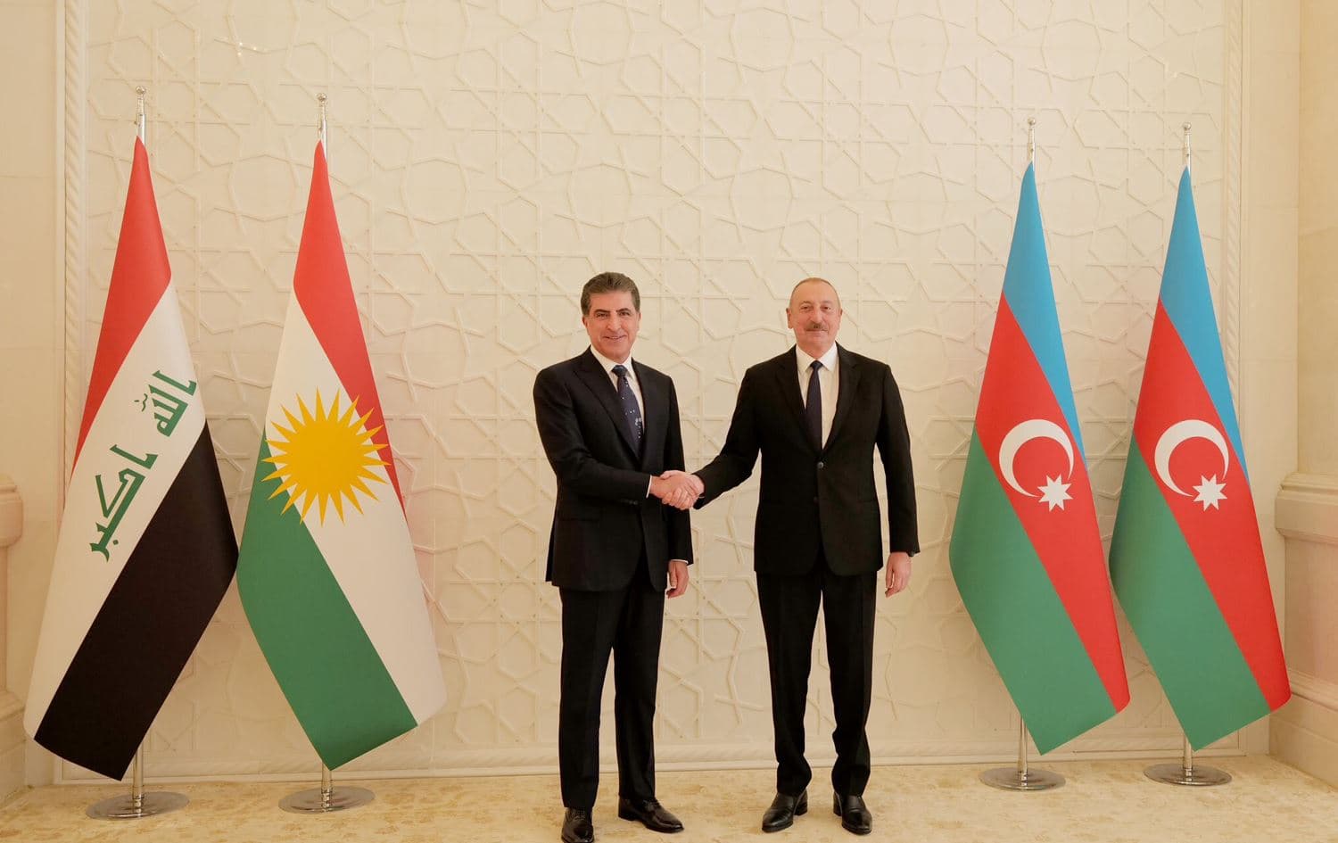 Kurdistan Region President Nechirvan Barzani (left) shakes hands with Azerbaijan's President Ilham Aliyev in Baku on July 18, 2023. Photo: Office of the President