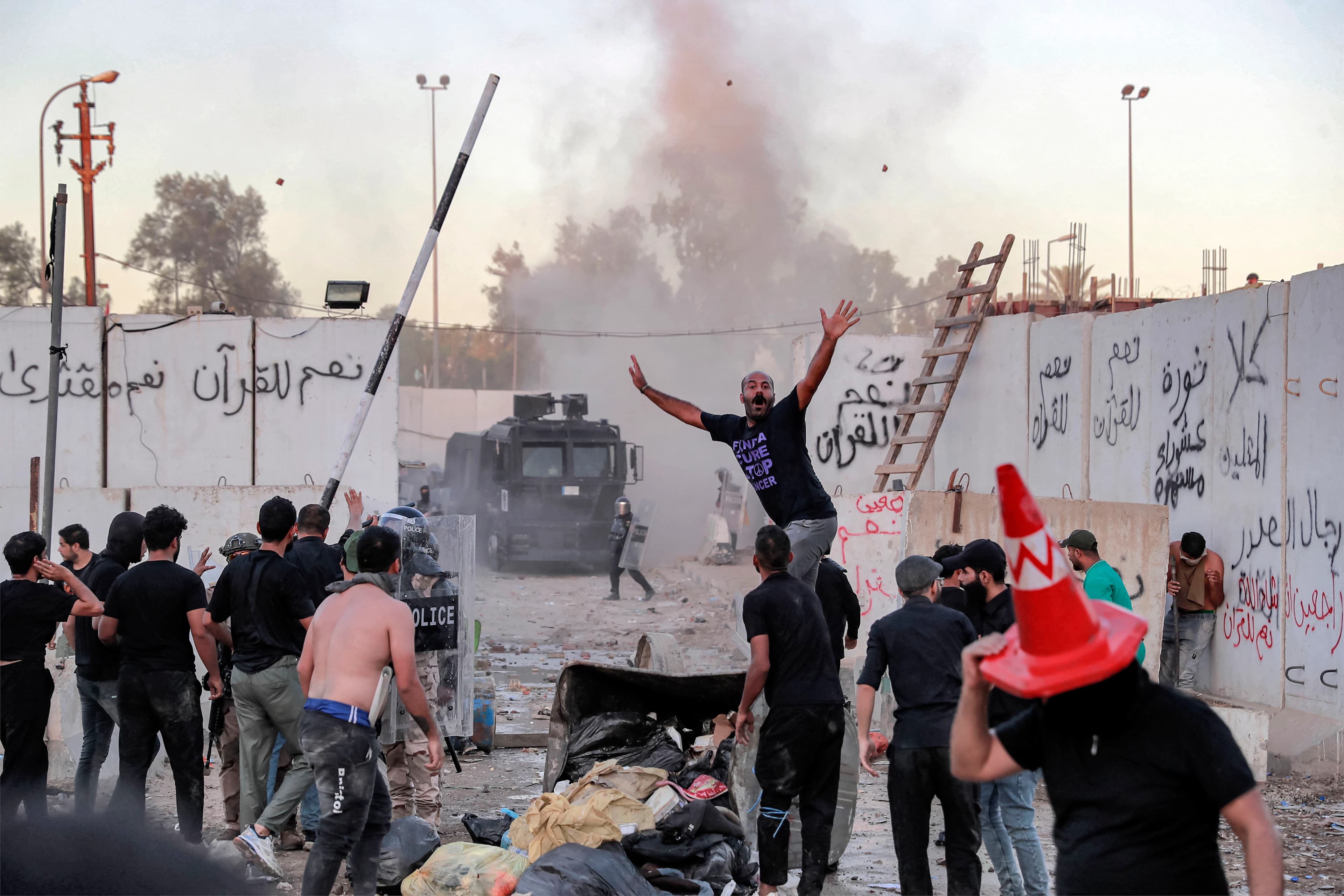 Iraqi riot police try to disperse supporters of Iraqi Shiite cleric Muqtada al-Sadr gathering for a protest outside the Swedish embassy in Baghdad on July 20, 2023. Photo: AFP 