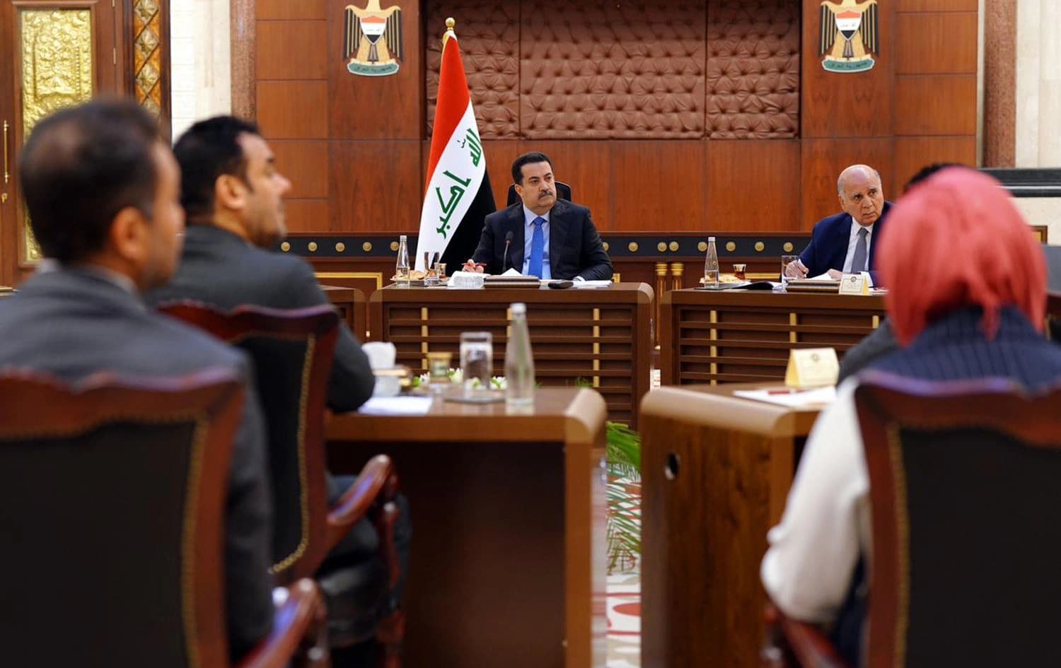 Iraq’s Prime Minister Mohammed Shia’ al-Sudani (center) review hydrocarbon bill draft with Baghdad and Erbil officials on August 2, 2023. Photo: PM Sudani's office