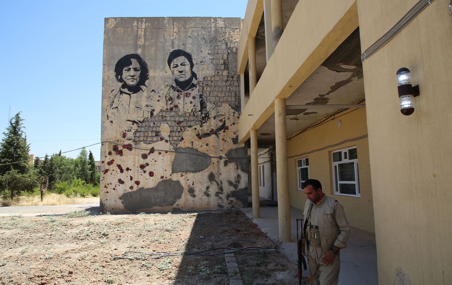A fighter looks on at the headquarters of the Kurdistan Democratic Party of Iran (KDPI) opposition group in Erbil's Koya province on July 15, 2019. Photo: Chris Johannes/Rudaw