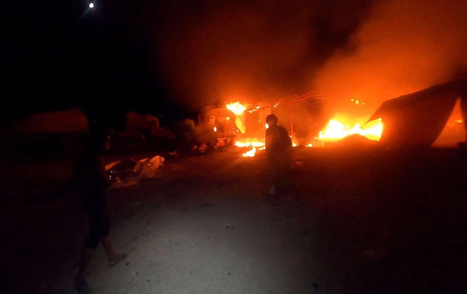 A camp on the near Sarmin, Idlib on fire after an alleged Syrian government rocket attack struck the facility, killing two civilians, on September 23, 2023. Photo: White Helmets
