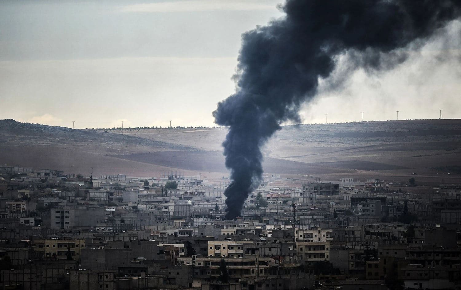 Smoke rises from Kobane in northern Syria during the fight against the Islamic State (ISIS) on October 19, 2014. Photo: AFP