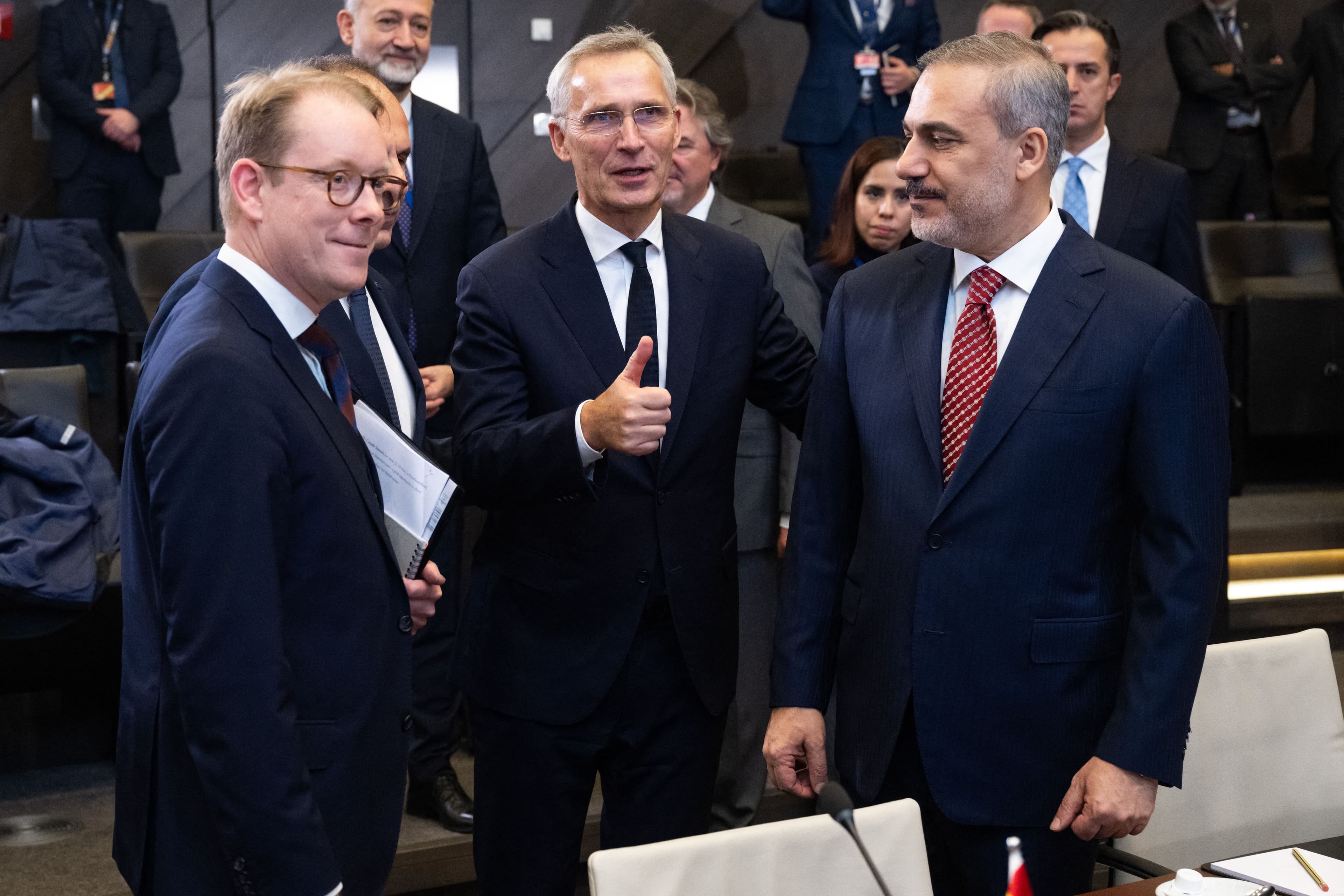 NATO Secretary General Jens Stoltenberg (C) speaks with Turkish Foreign Minister Hakan Fidan (R) and Swedish Foreign Minister Tobias Billstrom (L) prior to the start of the NATO foreign ministers meeting in Brussels on November 28, 2023. Photo: AFP 