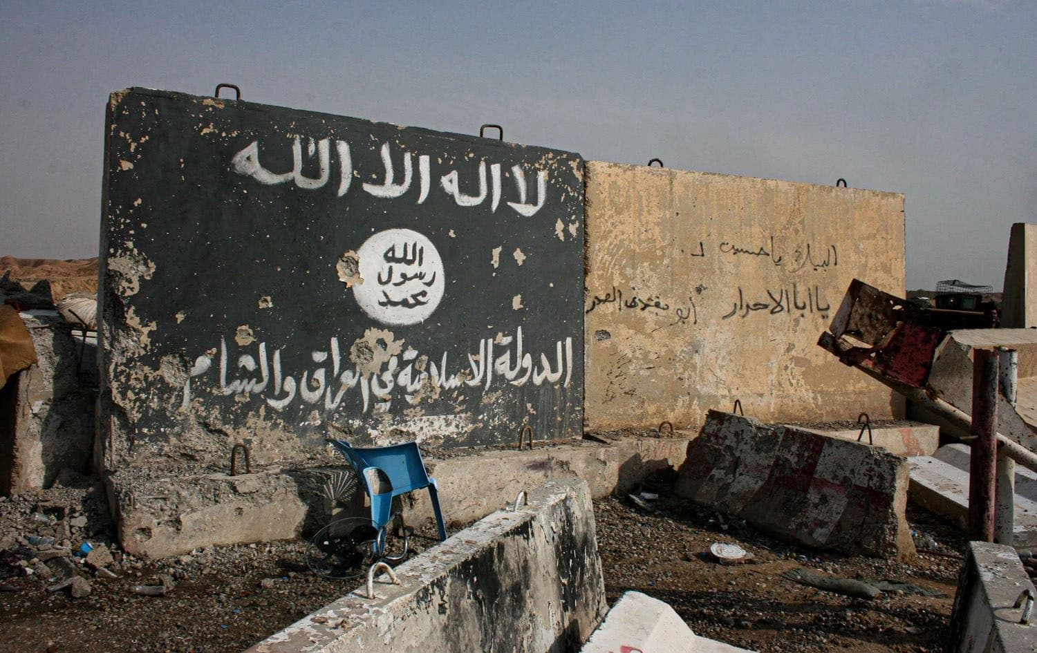 A wall painted by a falg used by ISIS is seen outside Mosul following its recapture by Peshmerga forces. Photo: Fazel Hawramy/Rudaw