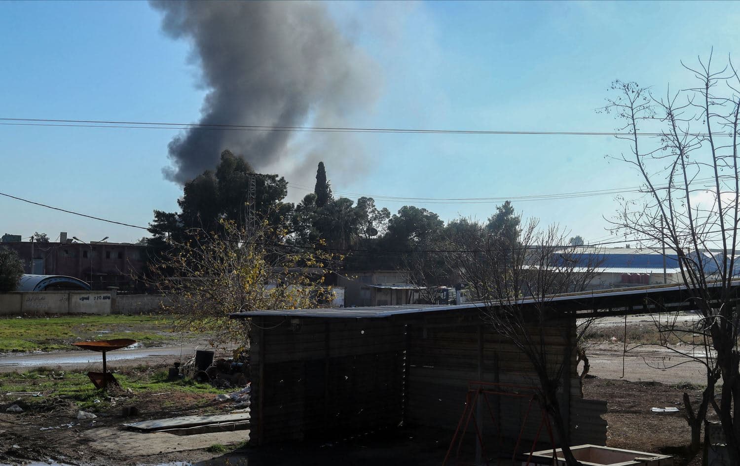 Smokes billows in Qamishli in northeastern Syria close to the Turkish border, amid Turkish military strikes in the area on December 25, 2023. Photo: Delil SOULEIMAN / AFP