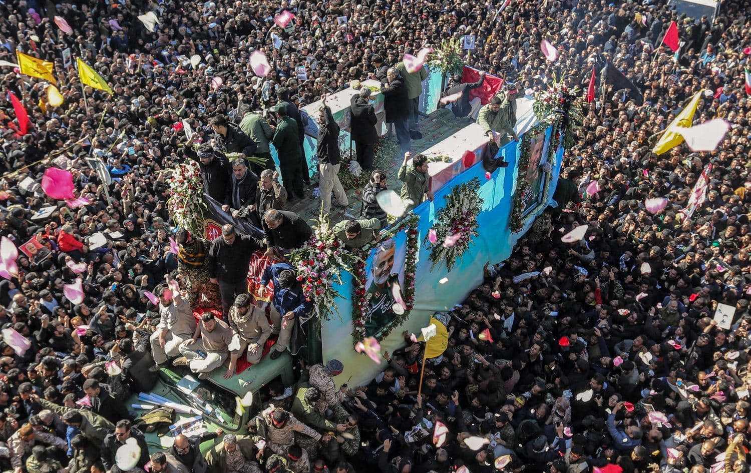 Iranian mourners gather around slain top general Qasem Soleimani's coffin during the commander's funeral processions, in Kerman on January 7, 2020. Photo: Atta Kenare / AFP