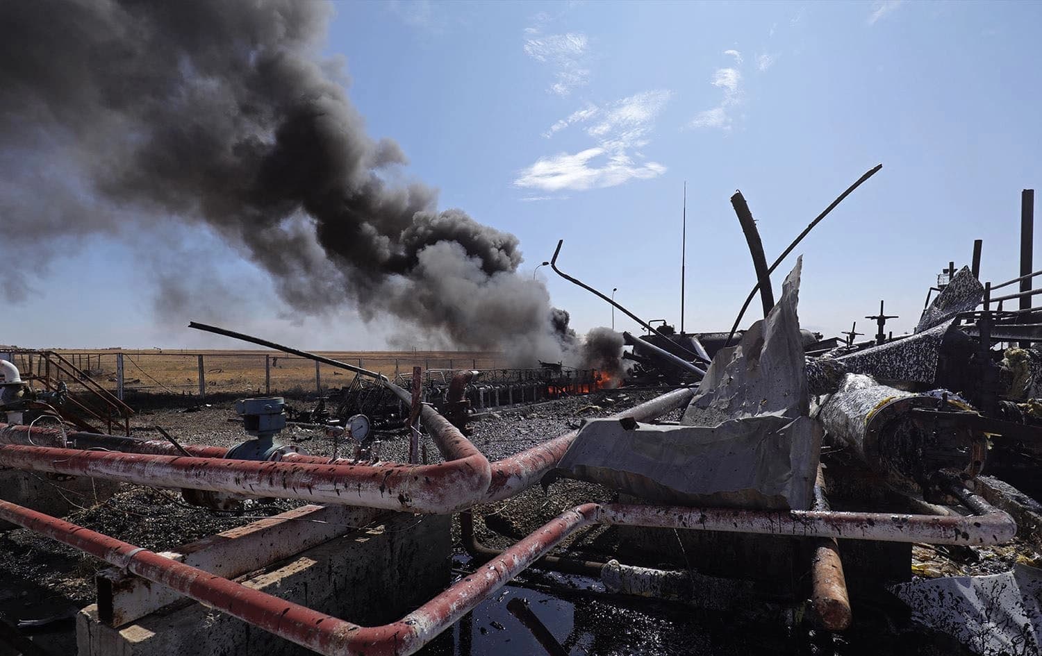The aftermath of a Turkish strike on the Babasi oil facility in the countryside of al-Qahtaniya in Syria's Kurdish-controlled northeastern Hasaka province on October 6, 2023. Delil Souleiman/AFP