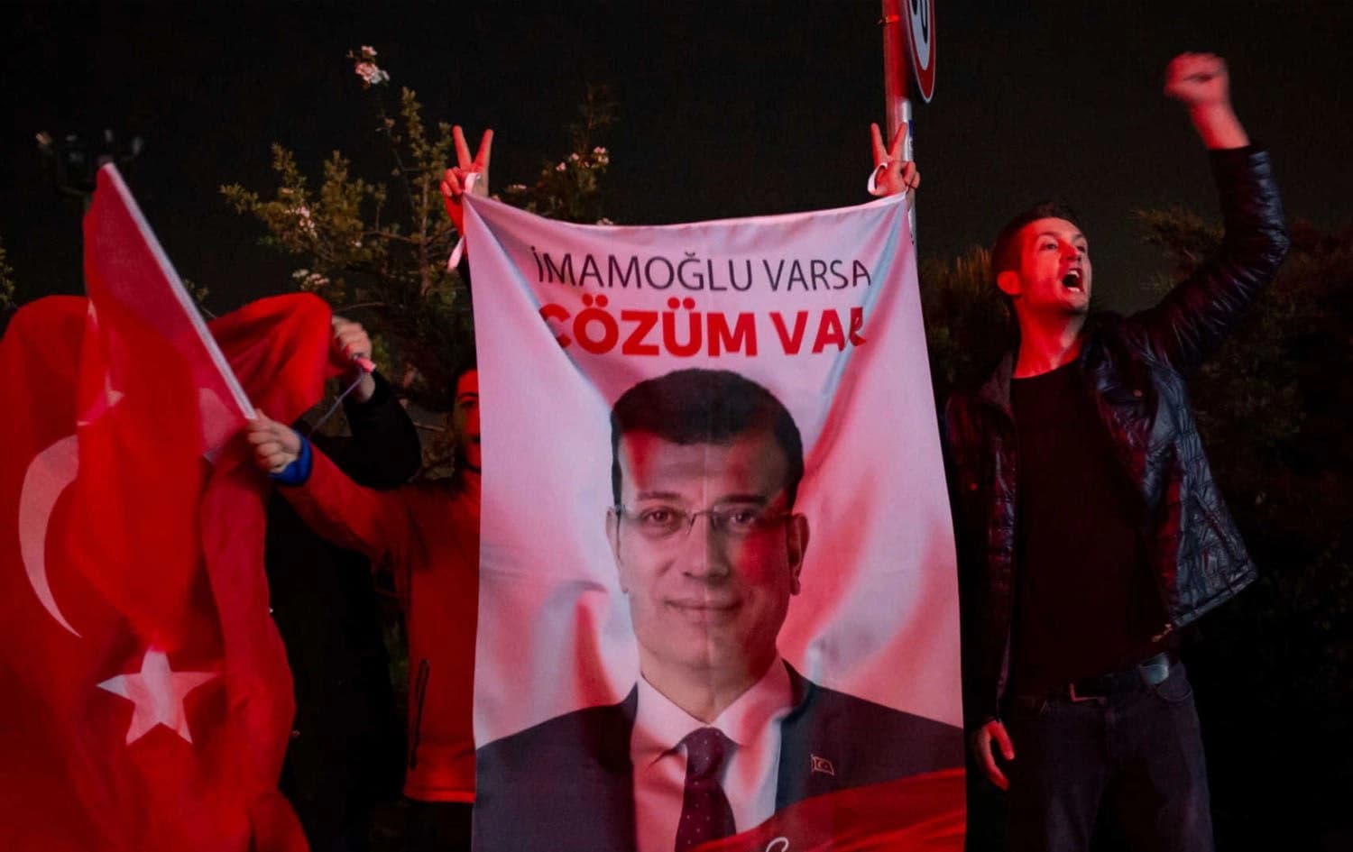 A poster depicting Istanbul Mayor Ekrem Imamoglu hoisted by supporters during a rally in 2019. File photo: AFP