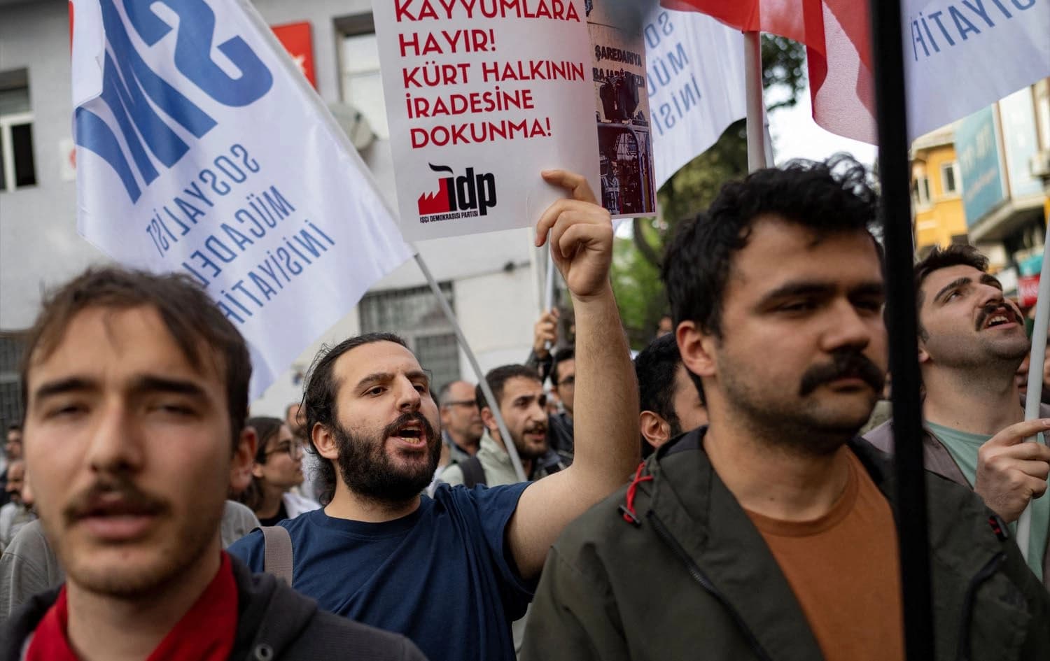 Supporters of pro-Kurdish Peoples' Equality and Democracy Party (DEM Party) take part in a demonstration after the party's Van candidate in Sunday's local elections was ruled ineligible at the last minute, in Istanbul on April 2, 2024. Photo: YASIN AKGUL / AFP
