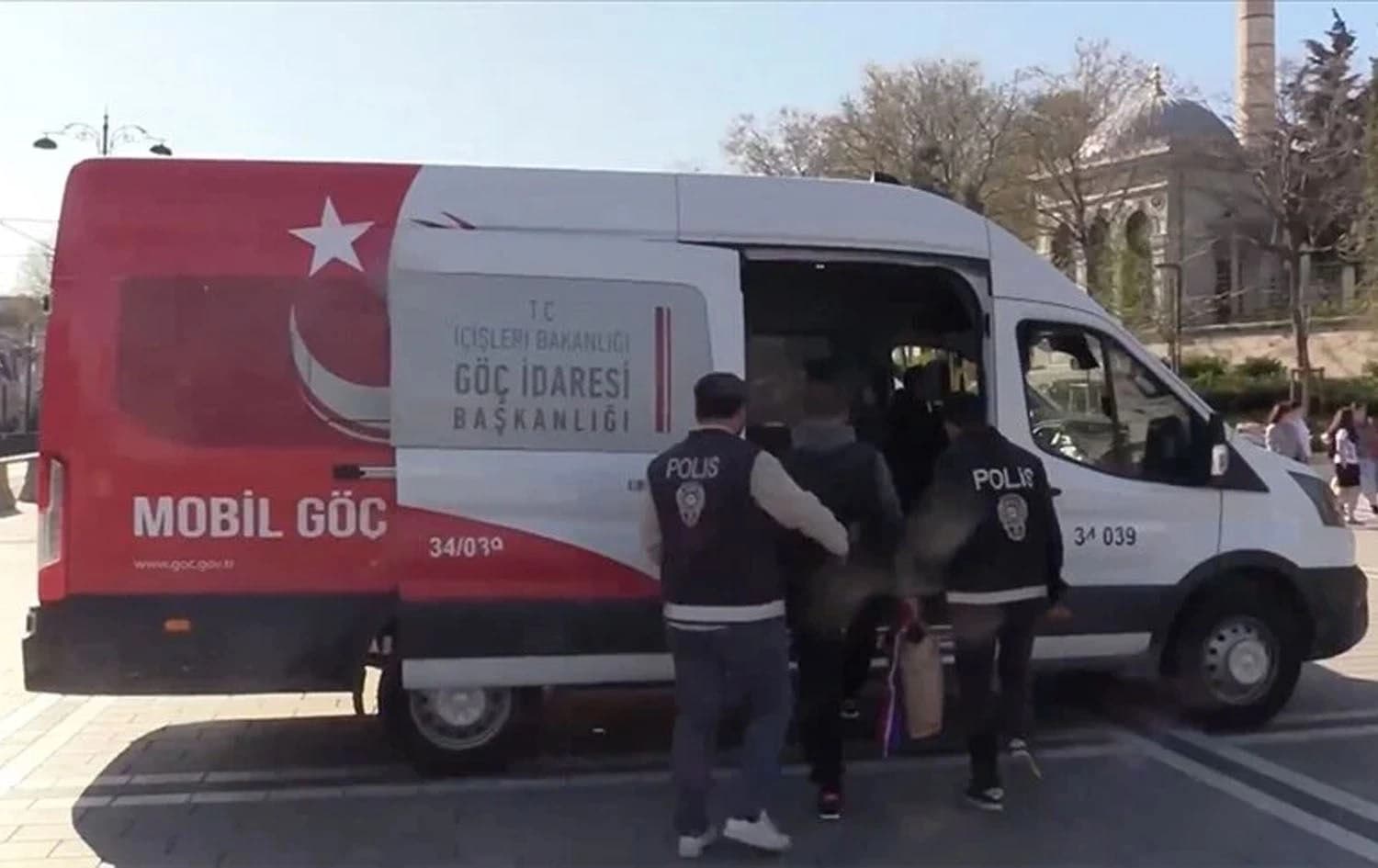 Turkish police taking an individual for status inspection. Photo: AA