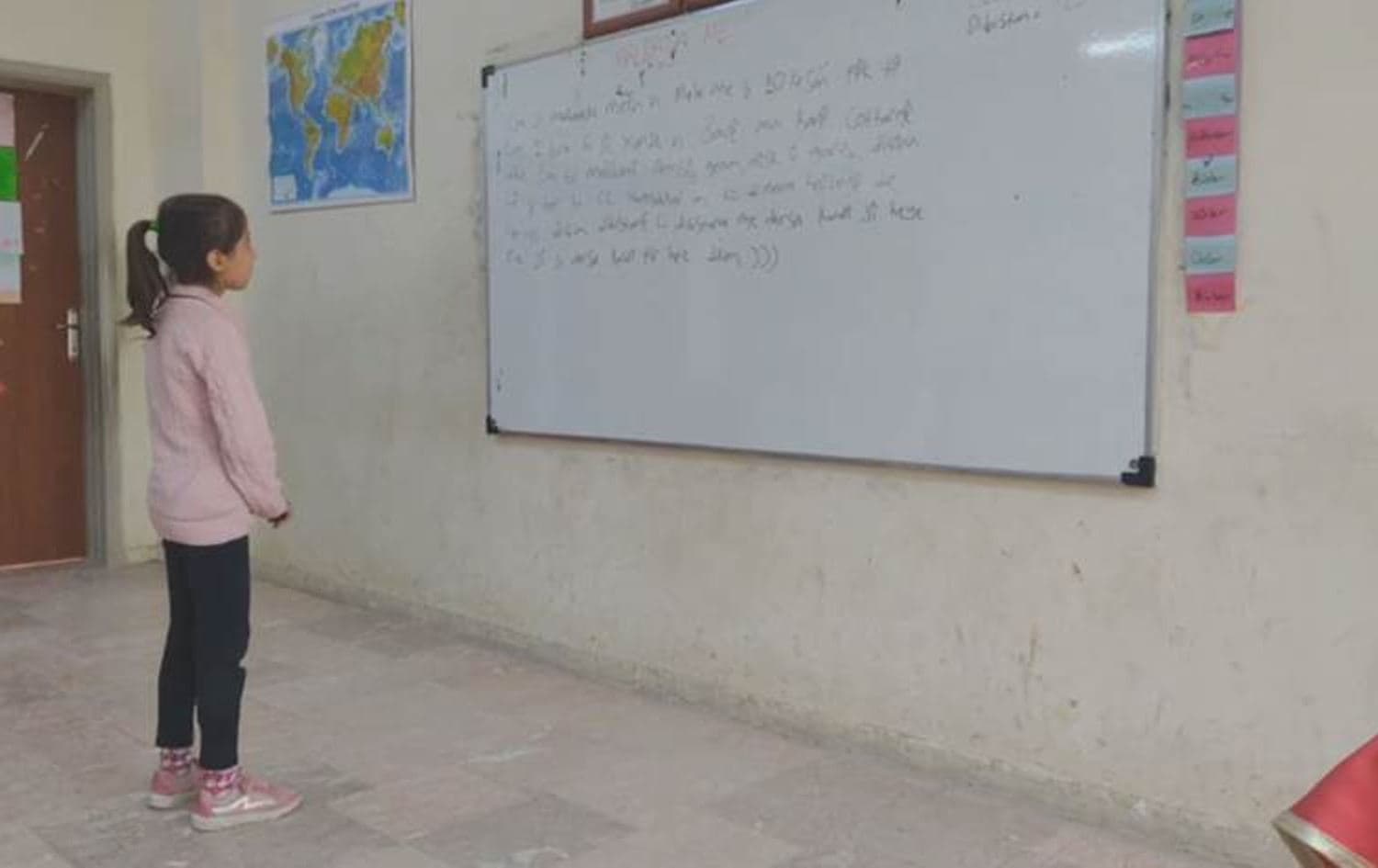 Young girl standing in front of a whiteboard in a school in Sanliurfa province in Turkey's southeast Kurdish region. Photo: Rudaw