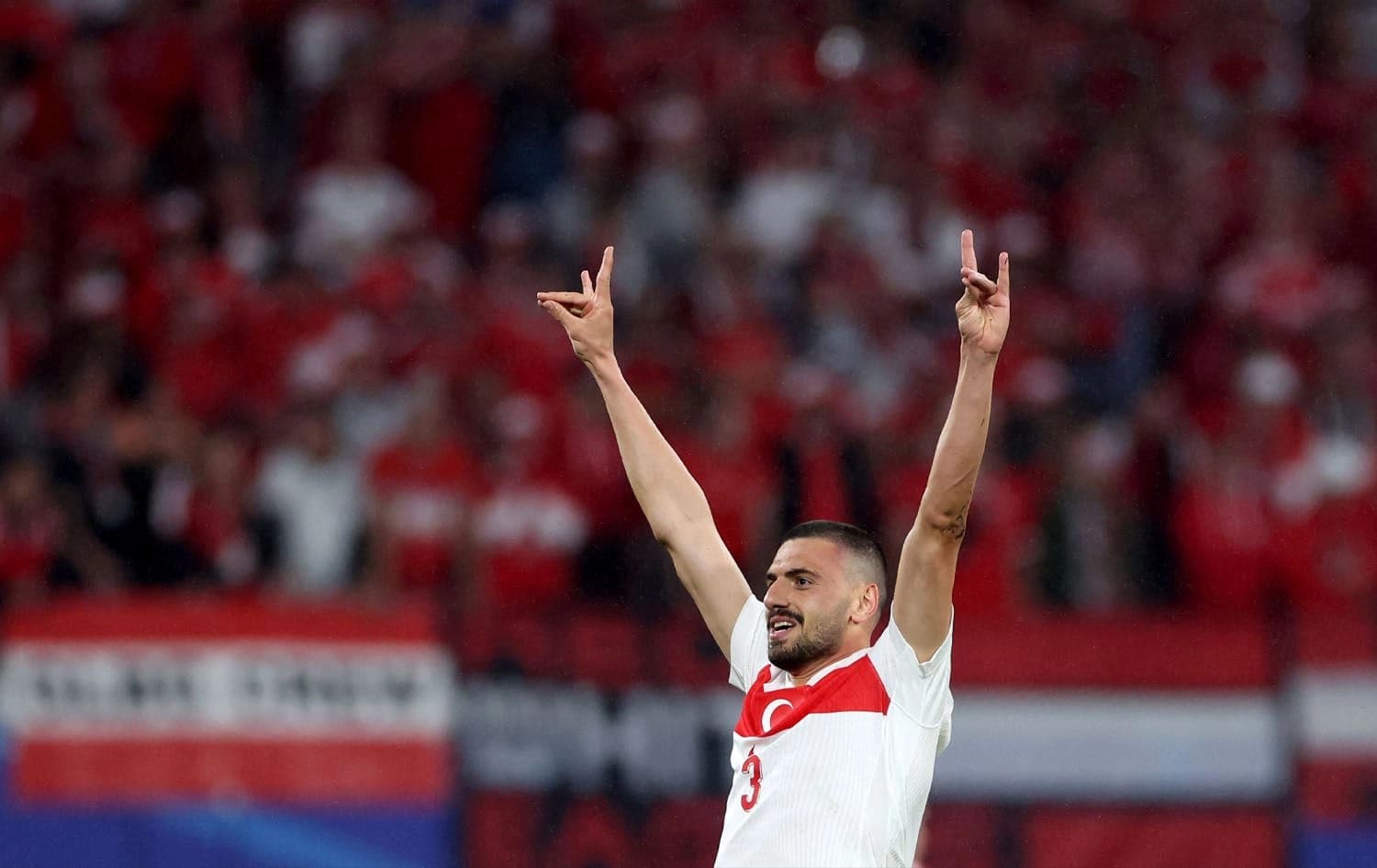 Turkey's defender #03 Merih Demiral makes a controversial hand gesture as he celebrates scoring his team's second goal during the UEFA Euro 2024 round of 16 football match between Austria and Turkey at the Leipzig Stadium in Leipzig on July 2, 2024. Photo: Ronny HARTMANN / AFP
