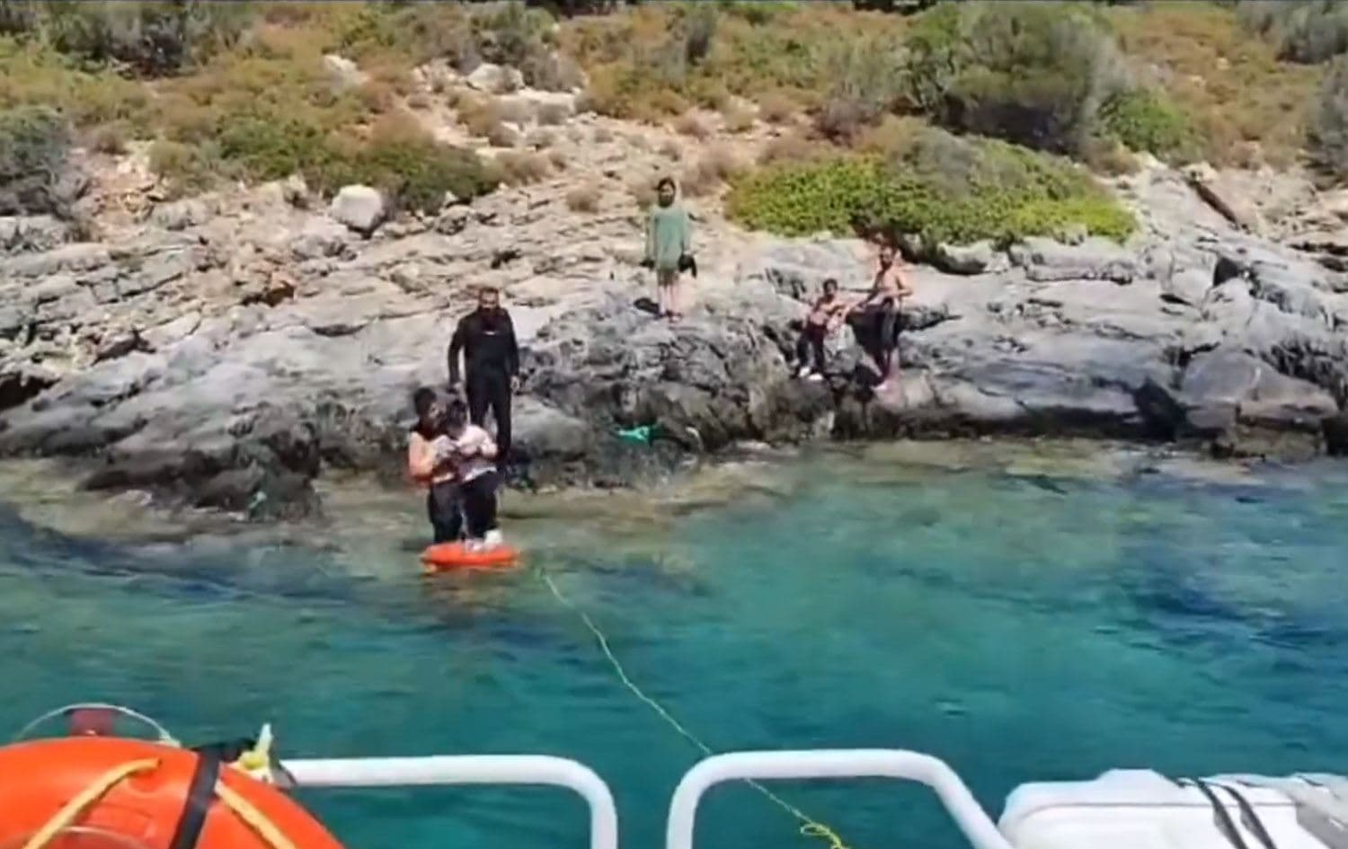Screengrab taken from a Turkish interior ministry video shows the Turkish Coast Guard rescuing migrants after a fishing boat capsized off the coast of Izmir in the Aegean Sea on July 9, 2024. Photo: Turkish Ministry of Interior/X