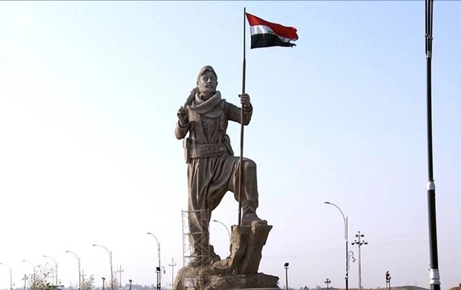 The Iraqi flag replaced the Kurdistan one on Kirkuk’s Peshmerga statue, guarding over the northern gate to the city, when Iraqi forces took over control of the city in October. Photo: Rudaw