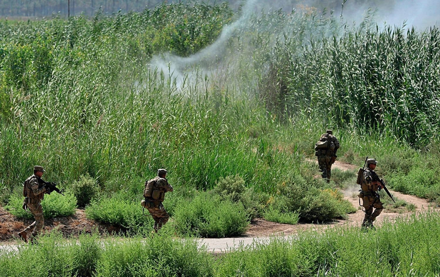 Iraqi security forces detonate an explosive device during a search operation in Tarmiyah, north of Baghdad, on July 23, 2019. Photo: Hadi Mizban/AP