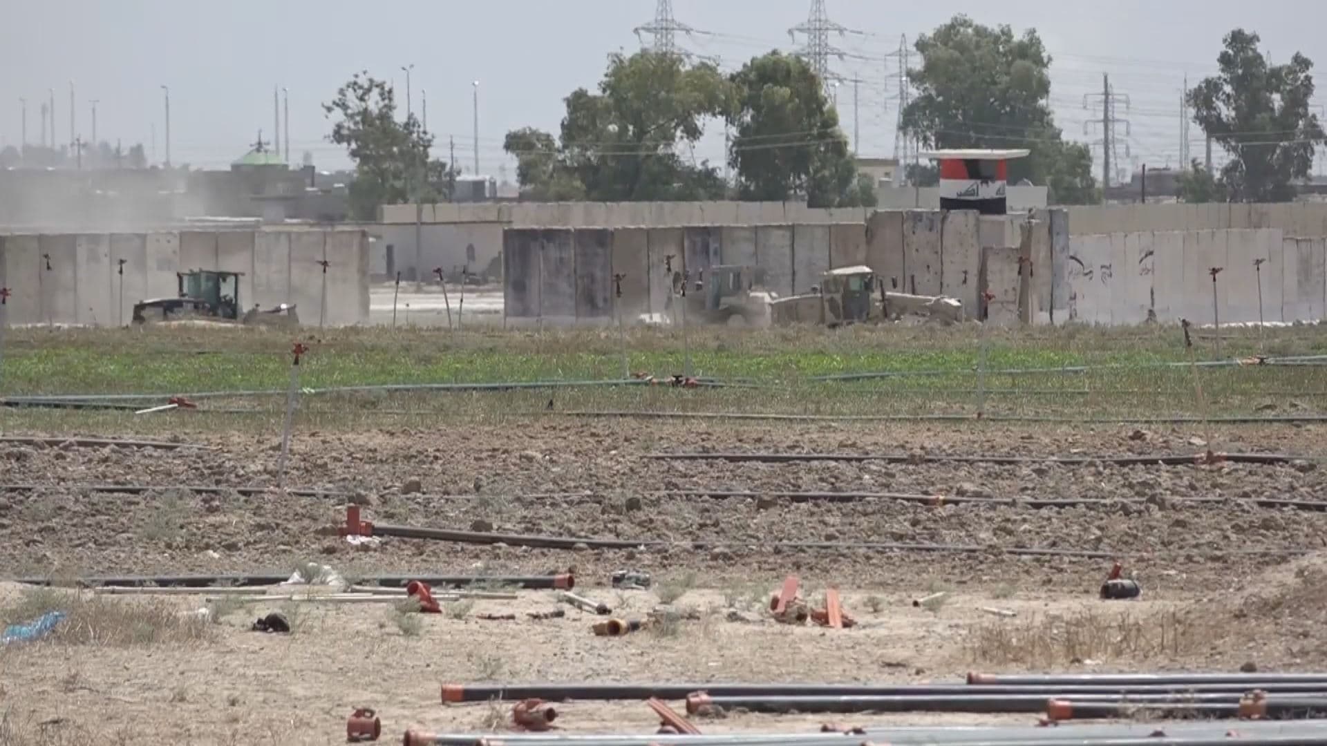 Iraqi government vehicles on a farmland in Topzawa village in Kirkuk on July 31, 20024. Photo: Rudaw/screengrab