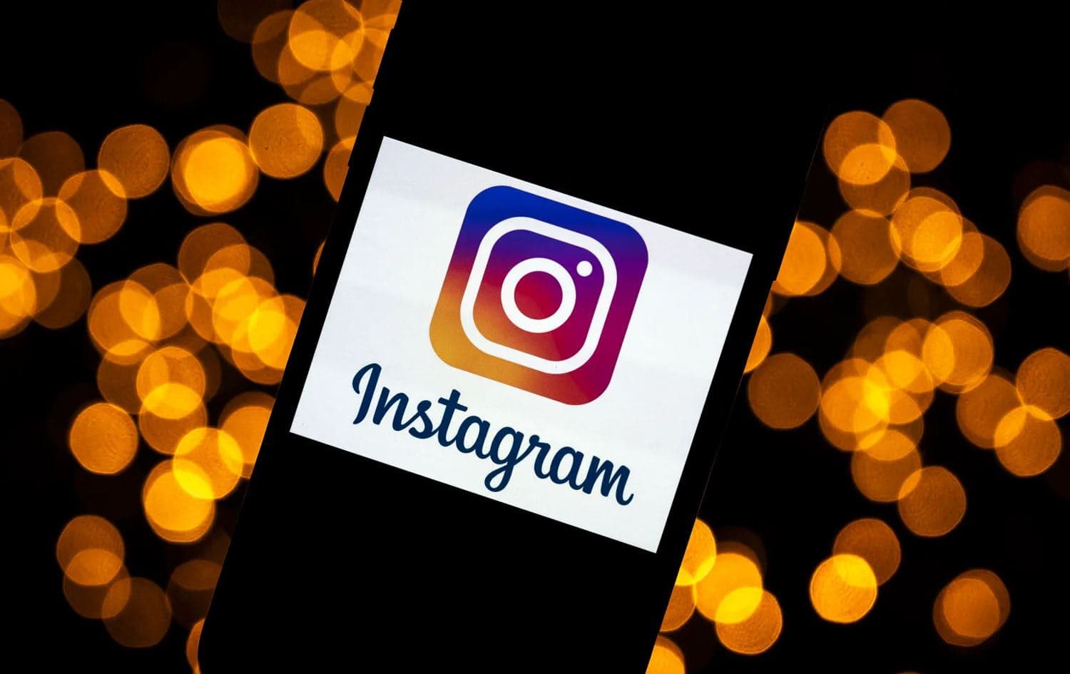 Instagram logo on a smartphone. Photo: LIONEL BONAVENTURE / AFP