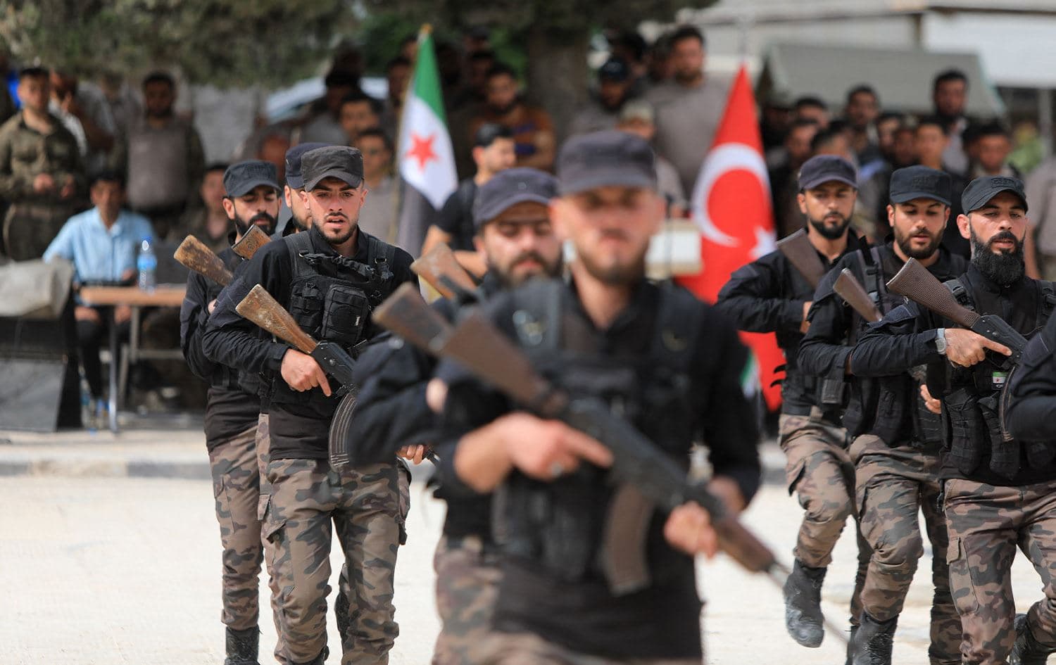 Turkey-backed fighters take part in a graduation ceremony at a Syrian opposition military base in the country's rebel-held northwestern Idlib province, on May 9, 2024. Photo: Bakr Alkasem/AFP