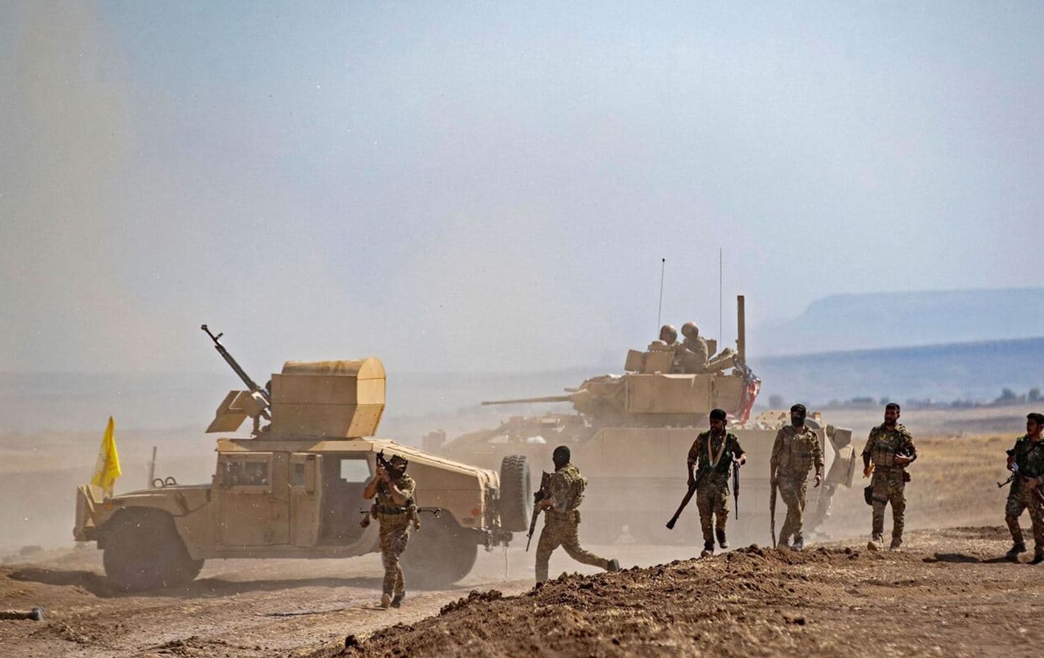 Syrian Democratic Forces gathering near a vehicle in 2022. File photo: AFP