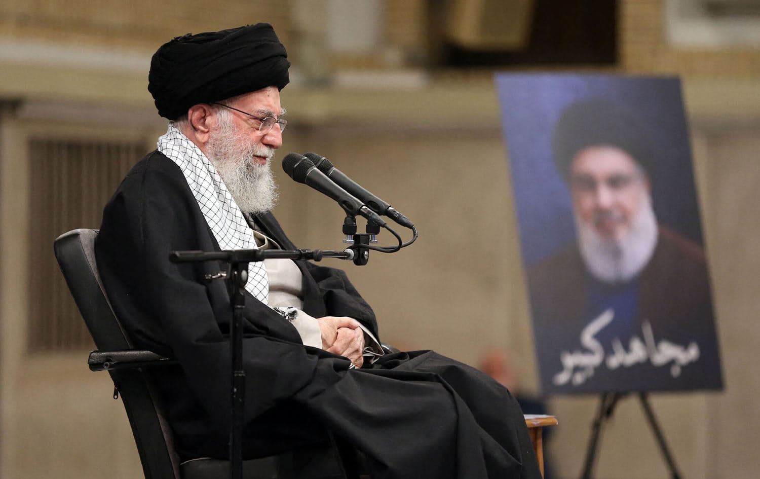 Iran's Supreme Leader Ayatollah Ali Khamenei shows him during a gathering of Iranian top scientific talents in Tehran on October 2, 2024, with a portrait of the slain leader of Lebanon's Hezbollah movement Hassan Nasrallah next to him. Photo: AFP PHOTO / HO / KHAMENEI.IR