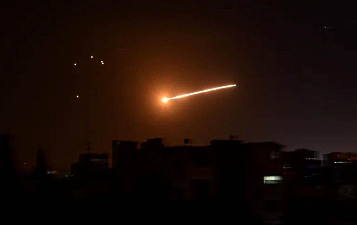 A handout picture released by SANA on February 24, 2020 reportedly shows Syrian air defense intercepting an Israeli missile in the sky over the Syrian capital Damascus. Photo: AFP
