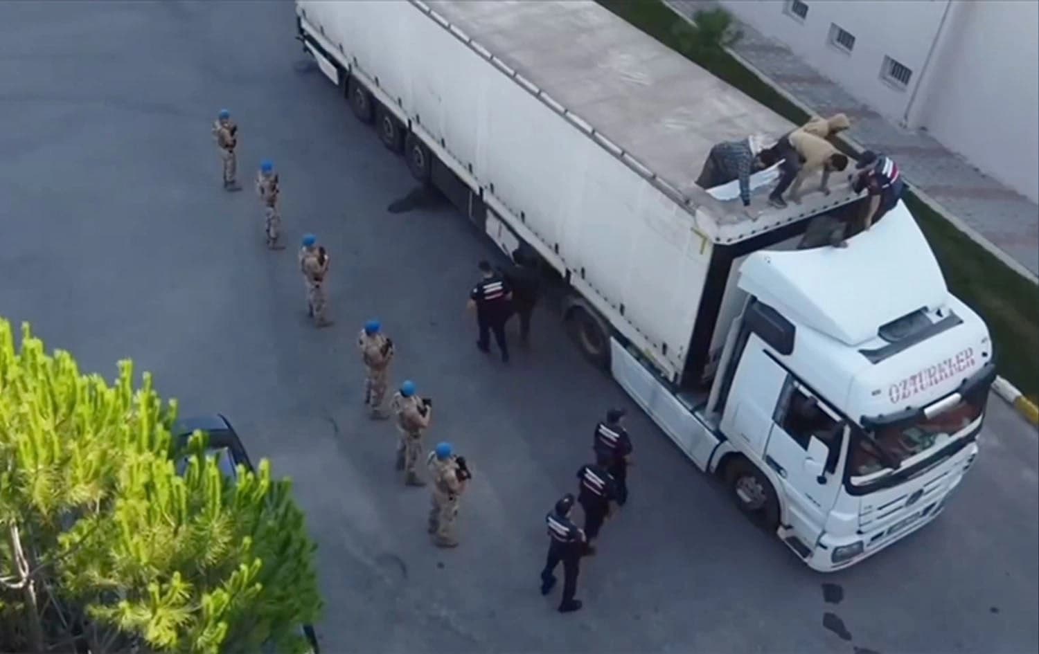 Turkish security forces surrounding a vehicle used to traffick migrants. Photo: Screengrab/Turkish interior ministry