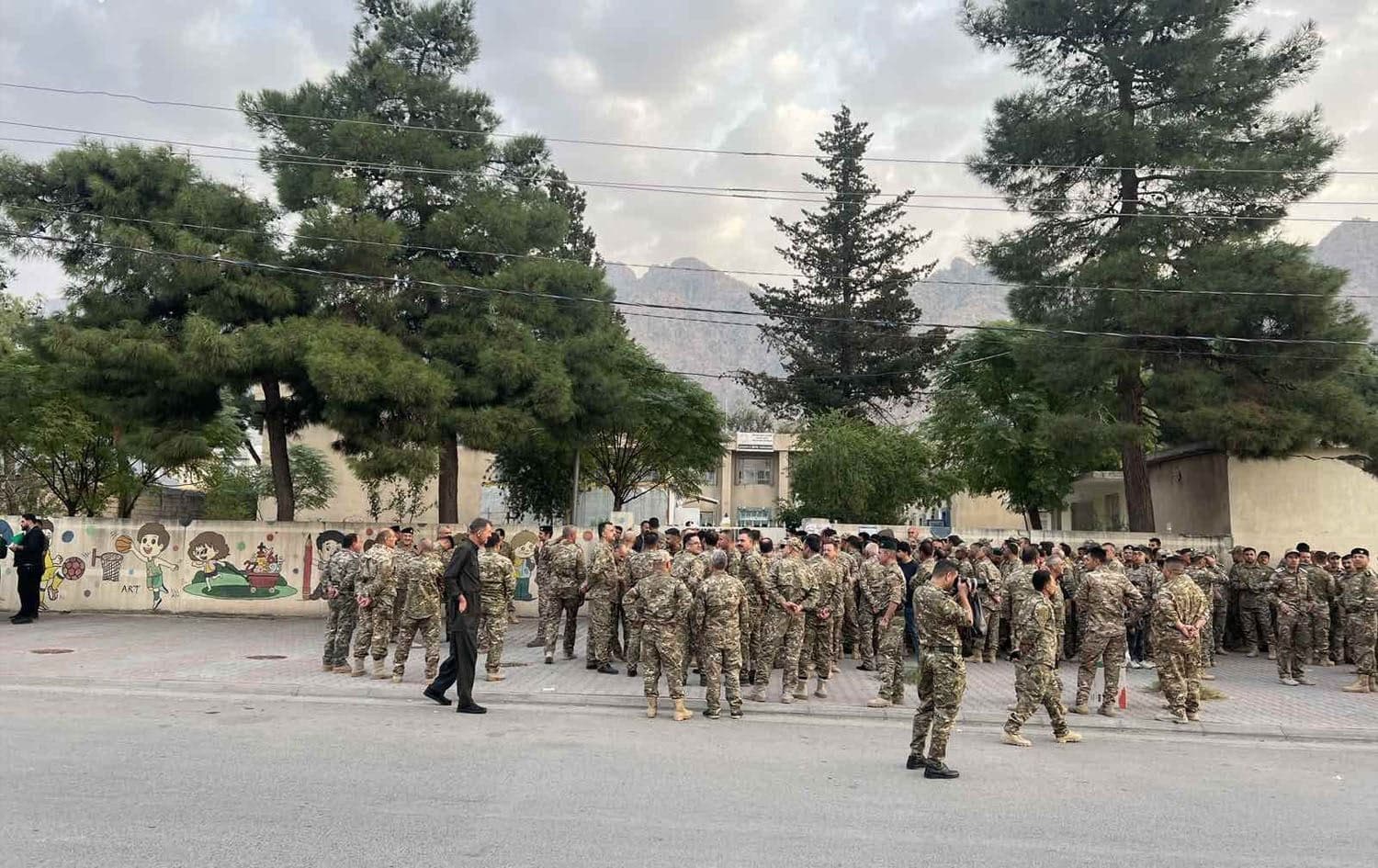 Members of security forces waiting for polling centers to open to cast their vote during early voting period in Kurdistan Region's parliamentary elections. Photo: Abubakir Ismail/Rudaw