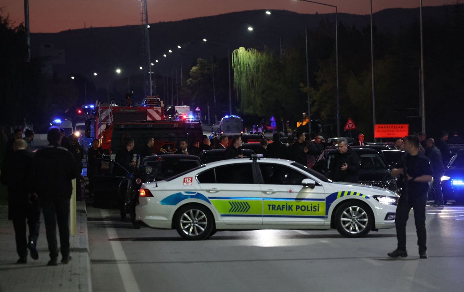 Turkish police officers secure part of a main road in Kahramankazan, some 40 kilometers (25 miles) north of Ankara on October 23, 2024, in the vicinity of the Turkish Aerospace Industries (TAI) building. Photo: Adem ALTAN / AFP