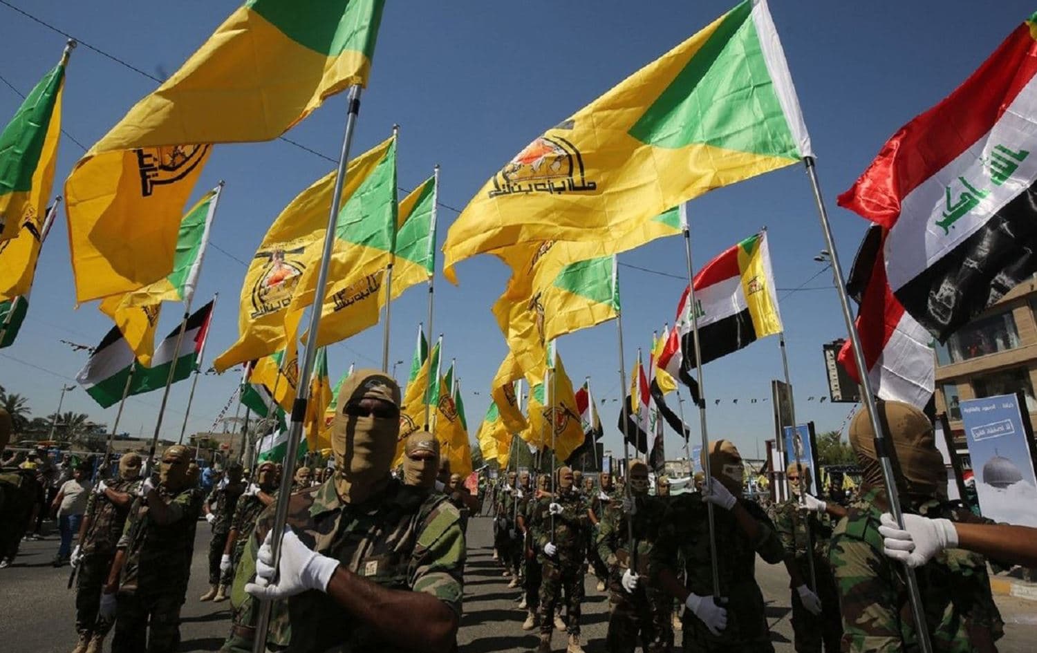 Pro-Iran Kataib Hezbollah marching in Iraq. File photo: AFP