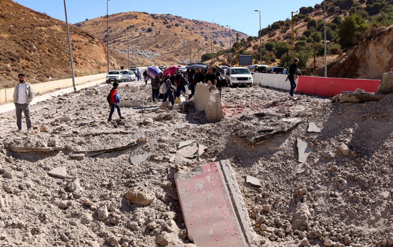 A crater caused by an Israeli strike, in the area of Masnaa on the Lebanese side of the border crossing with Syria, on October 4, 2024. Photo: AFP
