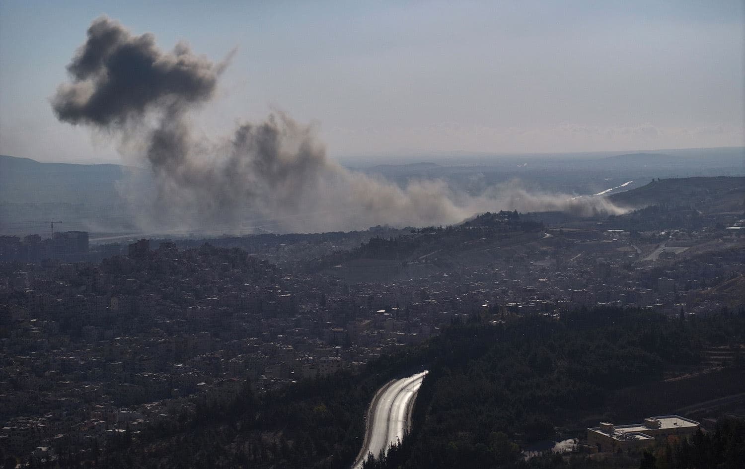 Smoke billows following an Israeli airstrike on the outskirts of Damascus on December 8, 2024. Photo: Omar Haj Kadour/AFP